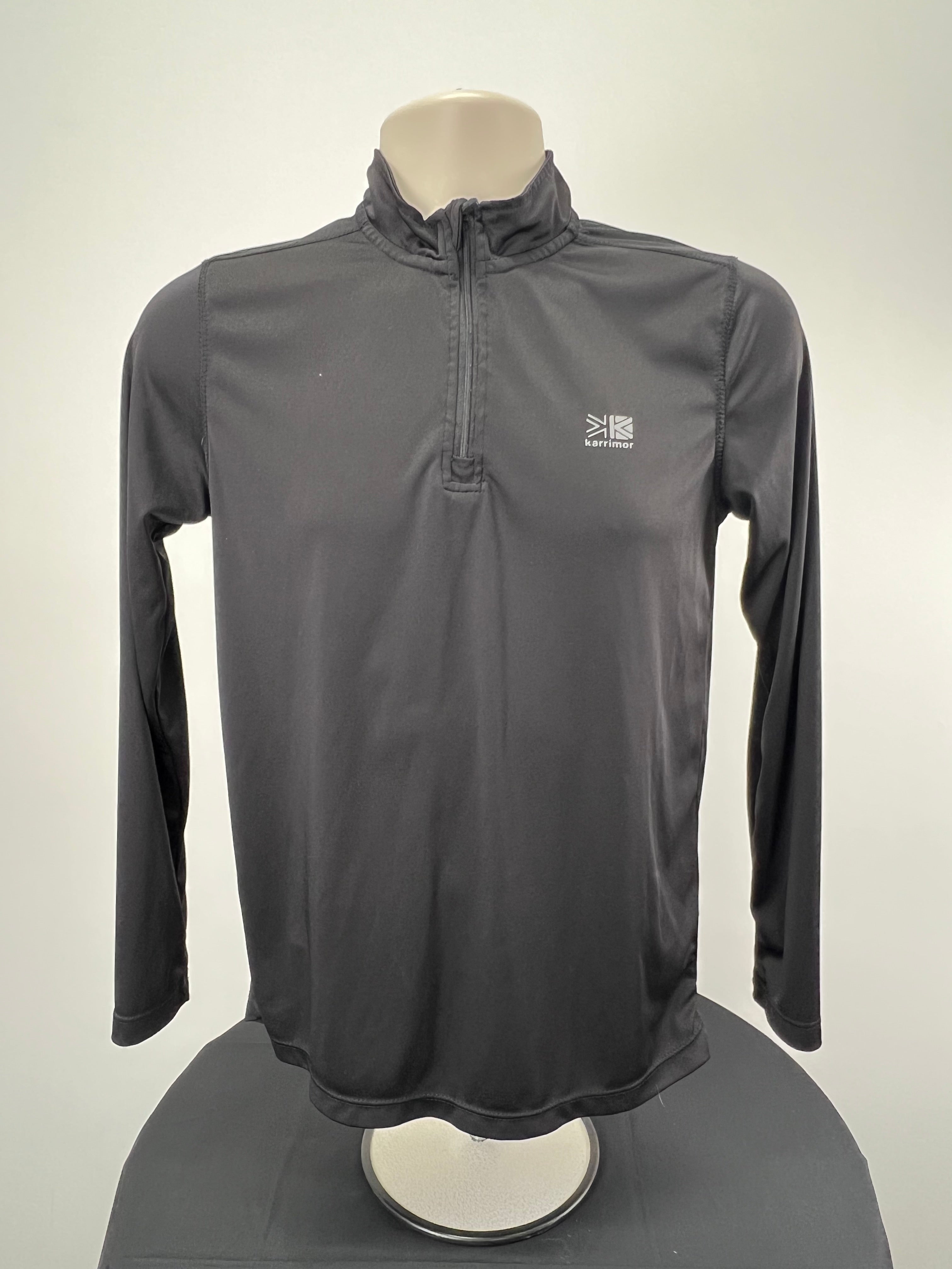 Front view of women’s black Karrimor 1/2 zip long sleeve running top on mannequin