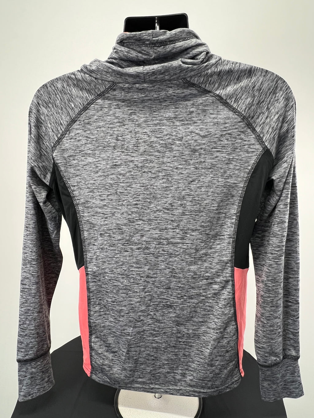 Back view of women's Crane long sleeve top showing grey marled fabric, black side panels, and pink lower side accents