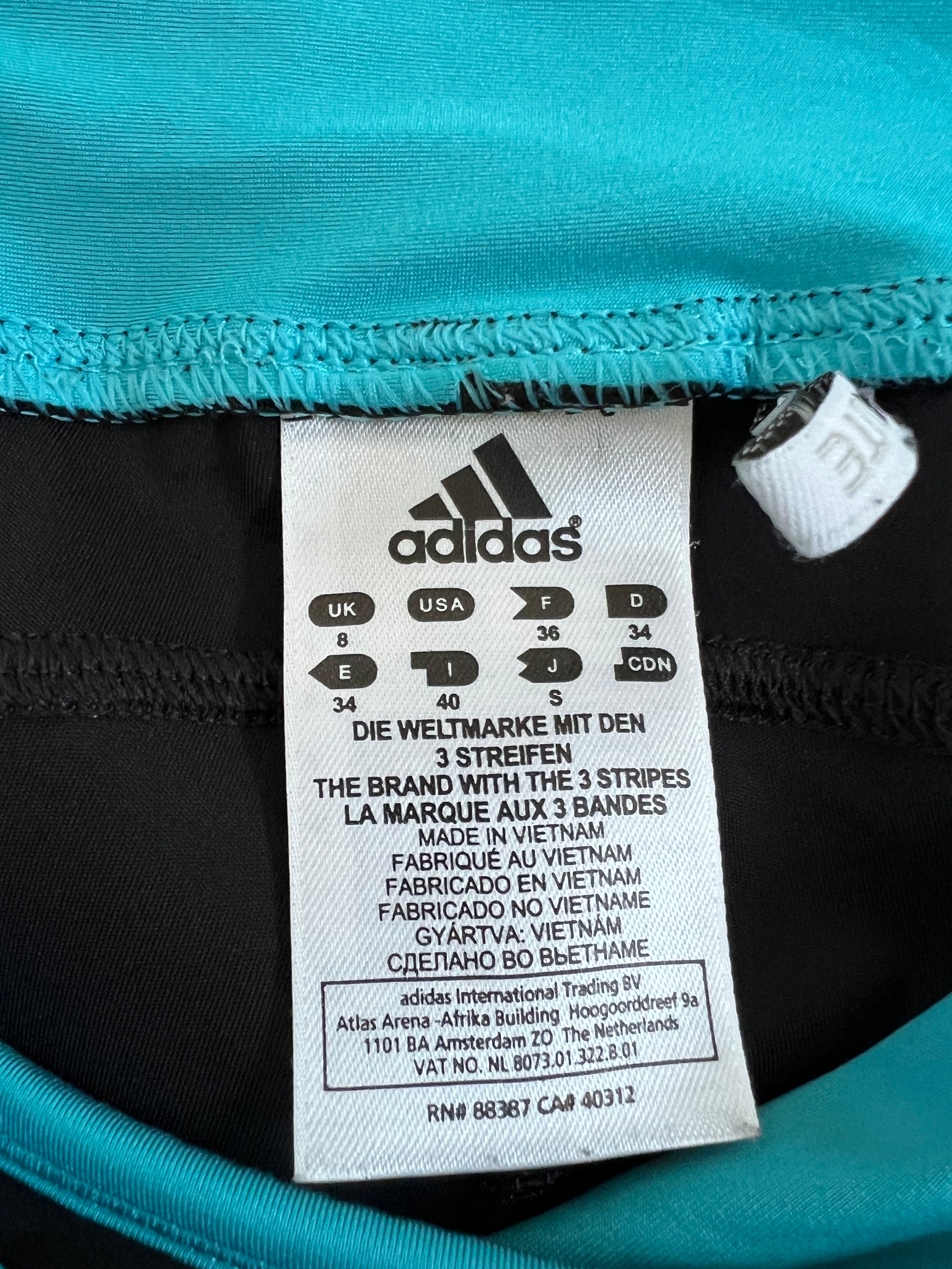 Close-up image of clothing tag showing Adidas branding and size S