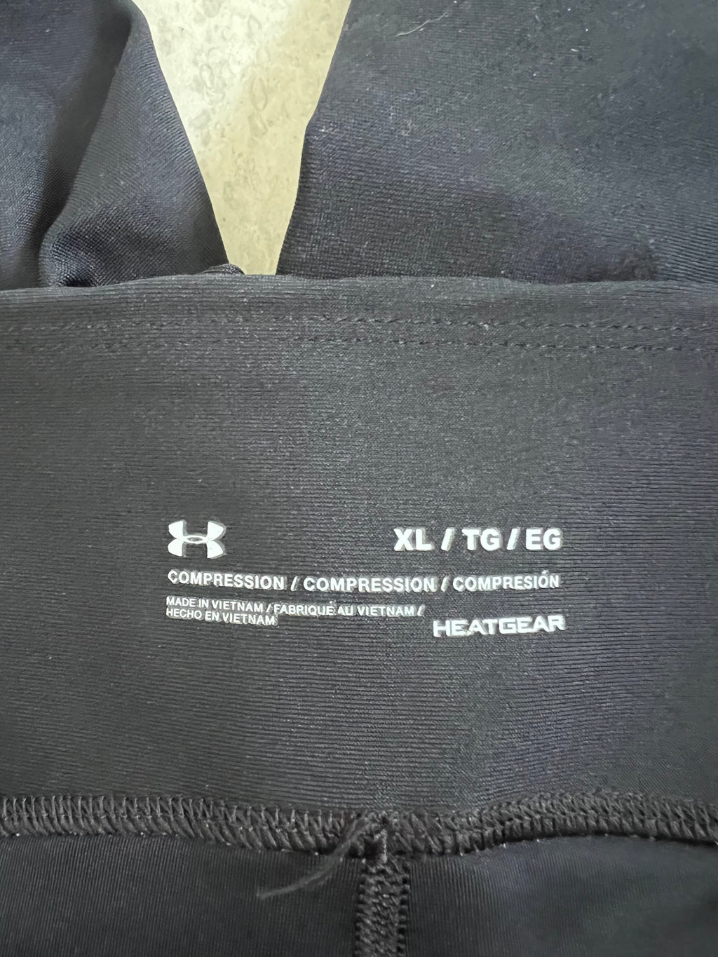 Close-up of internal tag showing size XL and HeatGear technology