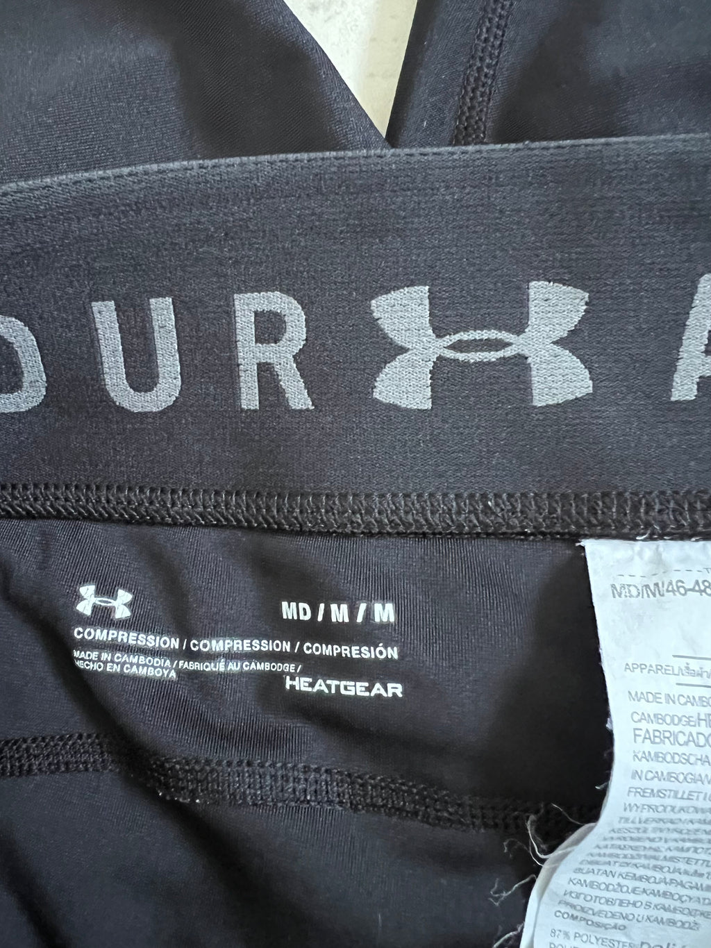 Detailed shot of Inside waistband seam and material texture on black leggings