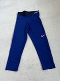 Front view of Nike Pro blue leggings with elasticated black waistband and white Nike logo