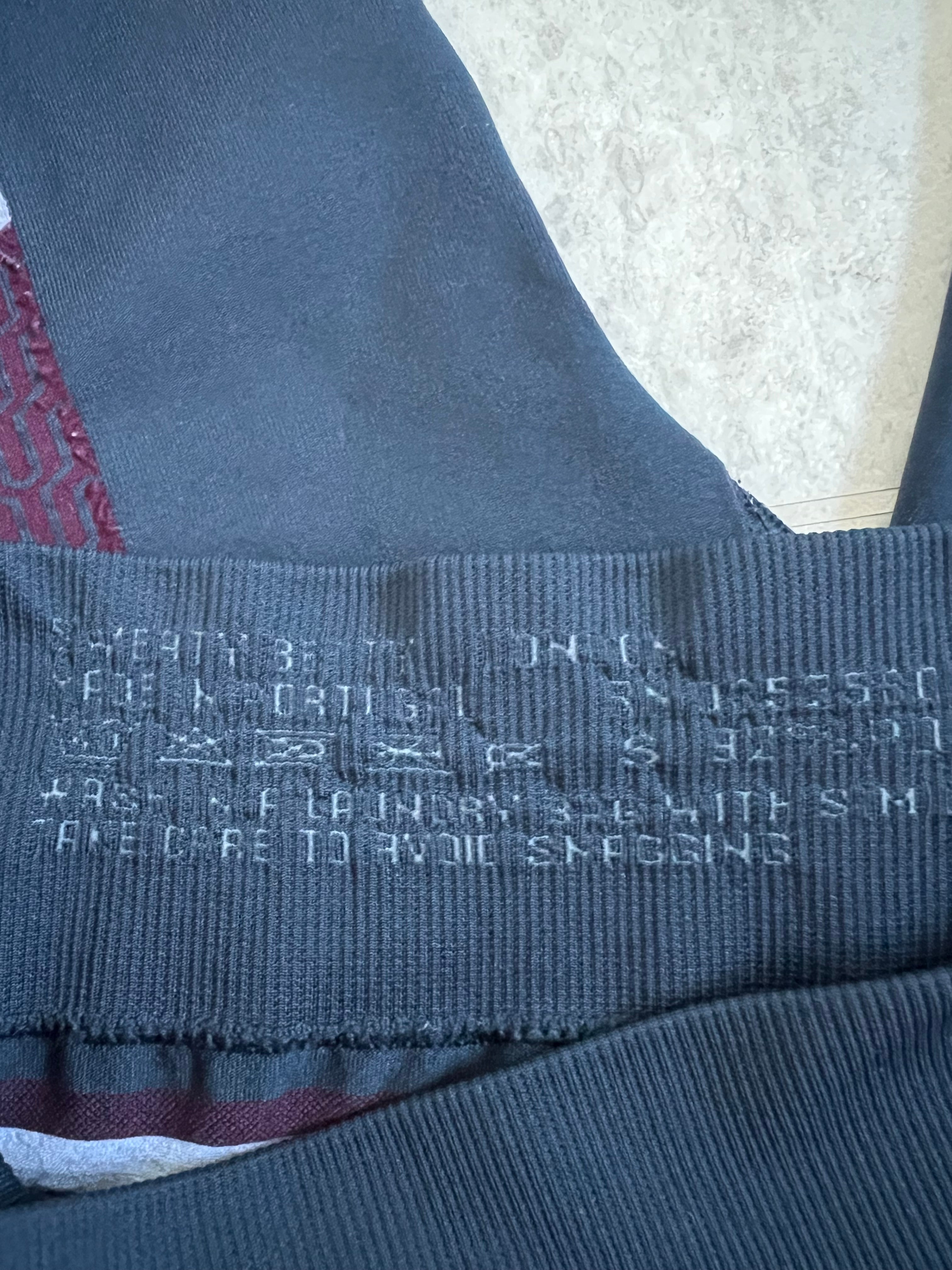 Close-up image of the inside waistband tag with product and size information on Sweaty Betty leggings