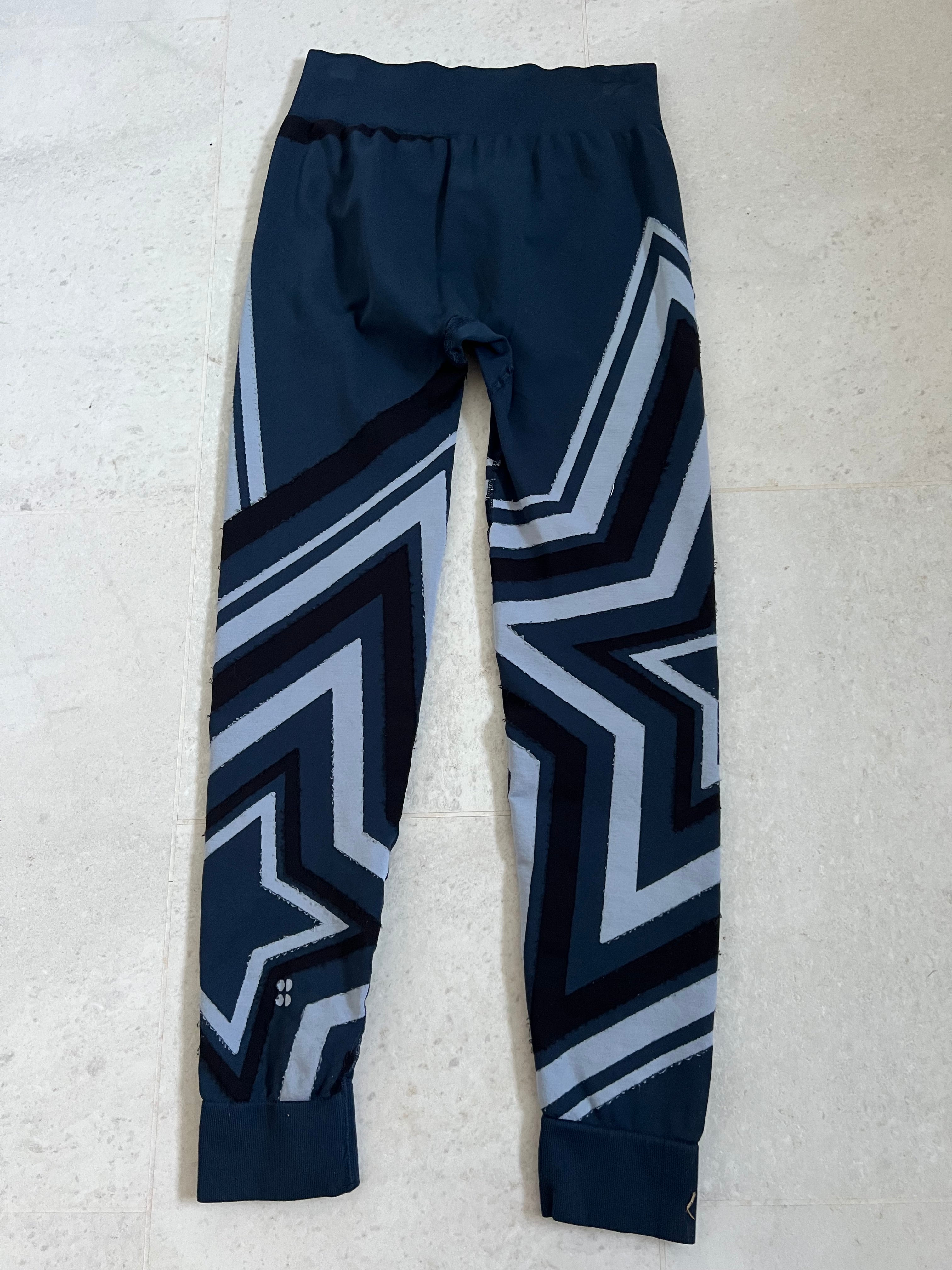 Back view of Sweaty Betty leggings showing matching patterned design and high waistband