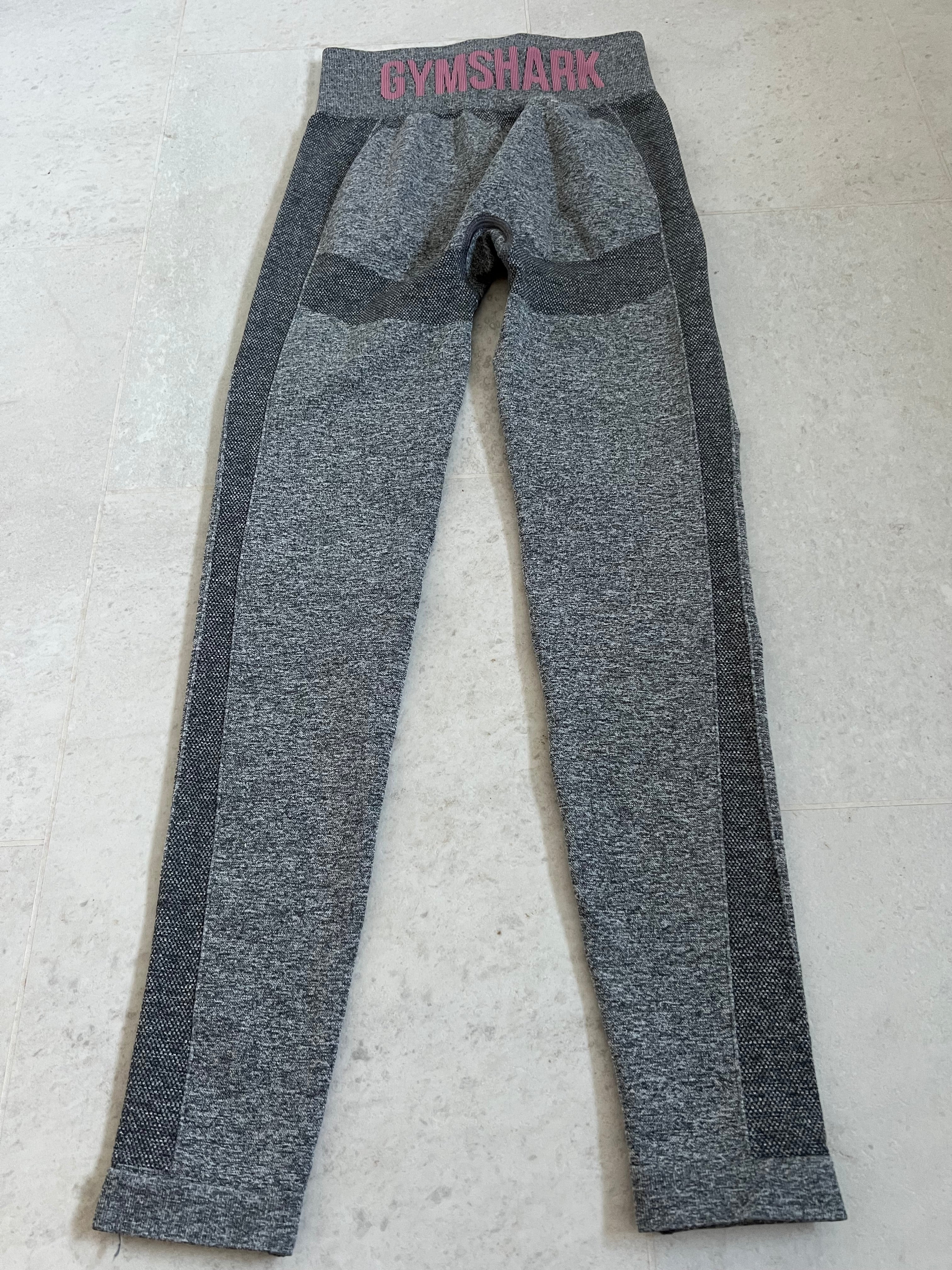 Back view of Gymshark grey marl full length leggings showing waistband branding