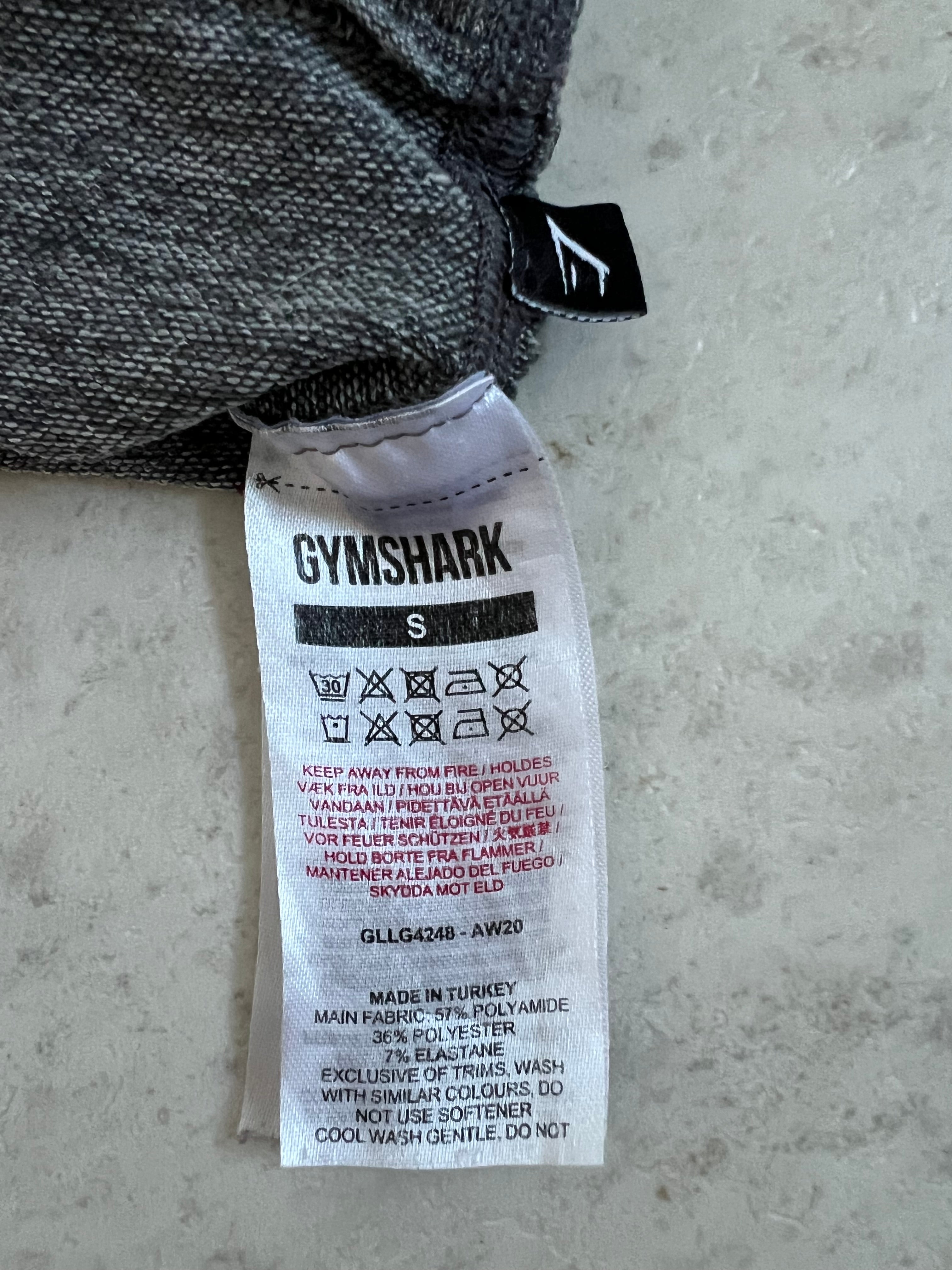 Close-up of Gymshark leggings care label and fabric composition