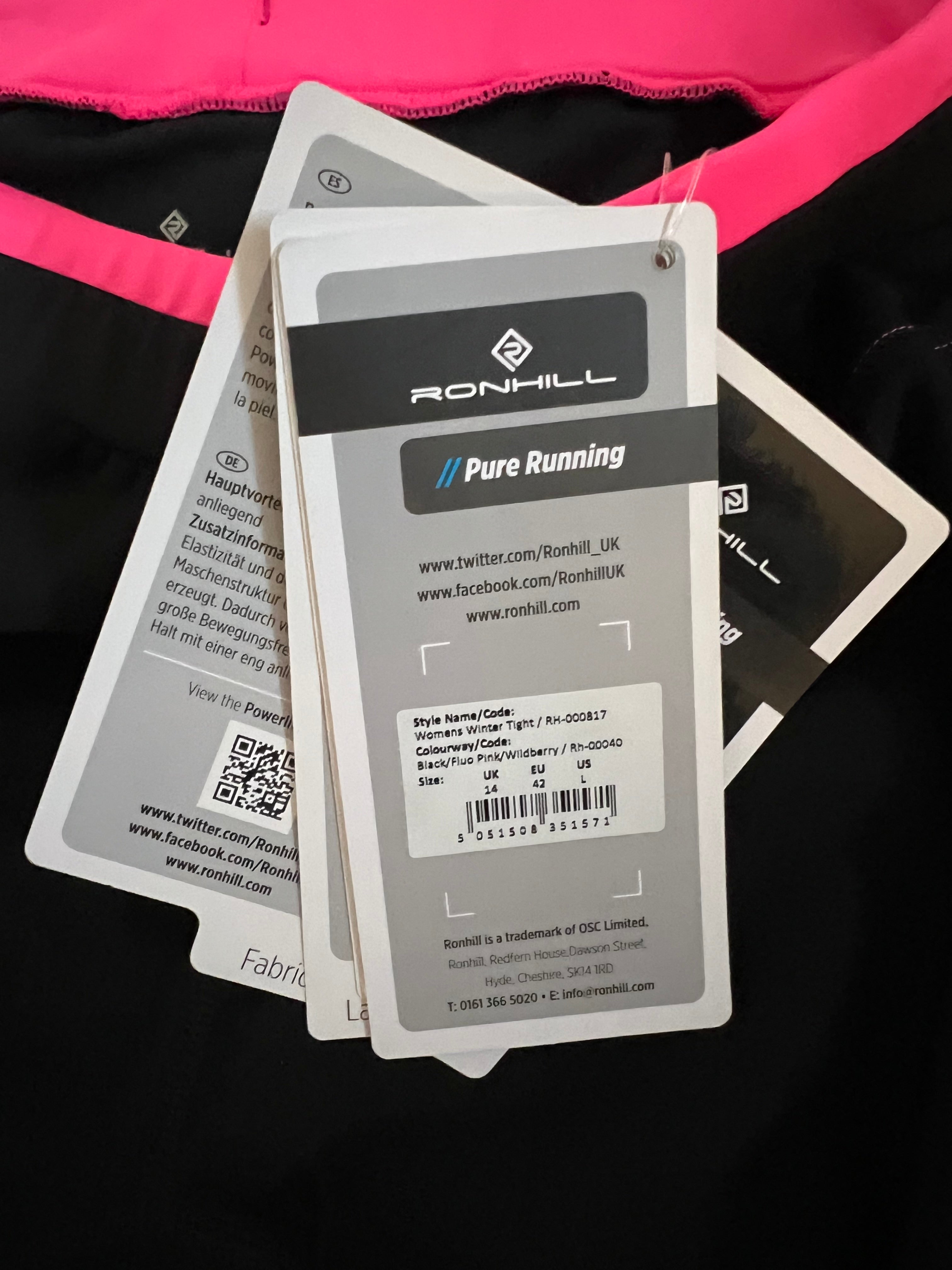 Tags attached to Ronhill running leggings showing product details and size 14