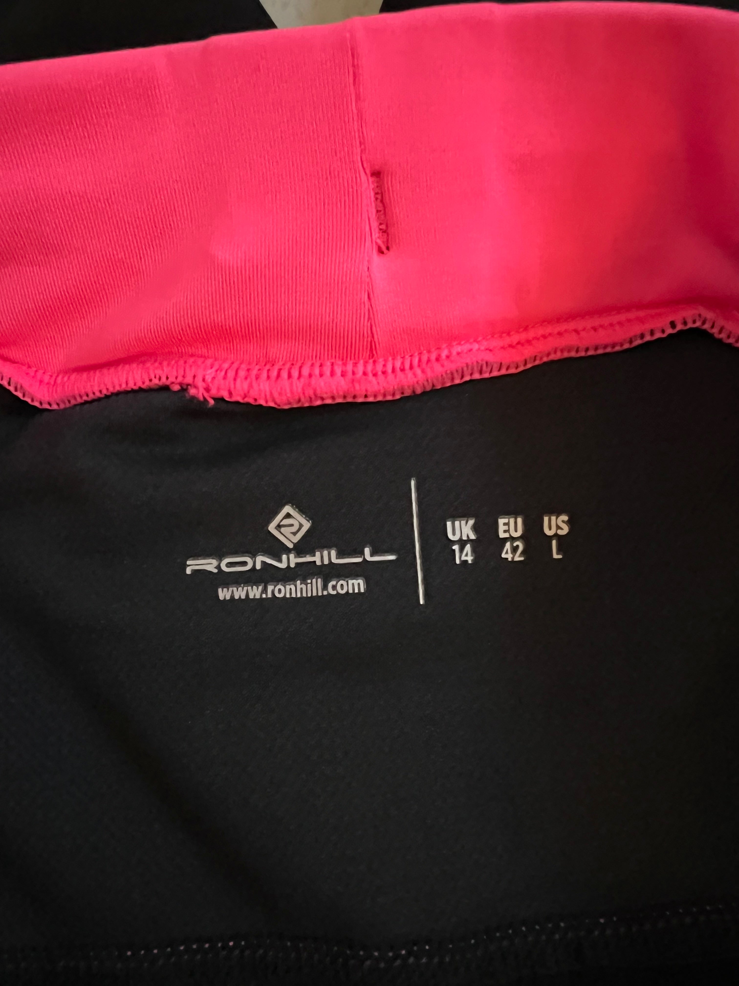 Inside waistband showing Ronhill logo and size 14 printed on black fabric
