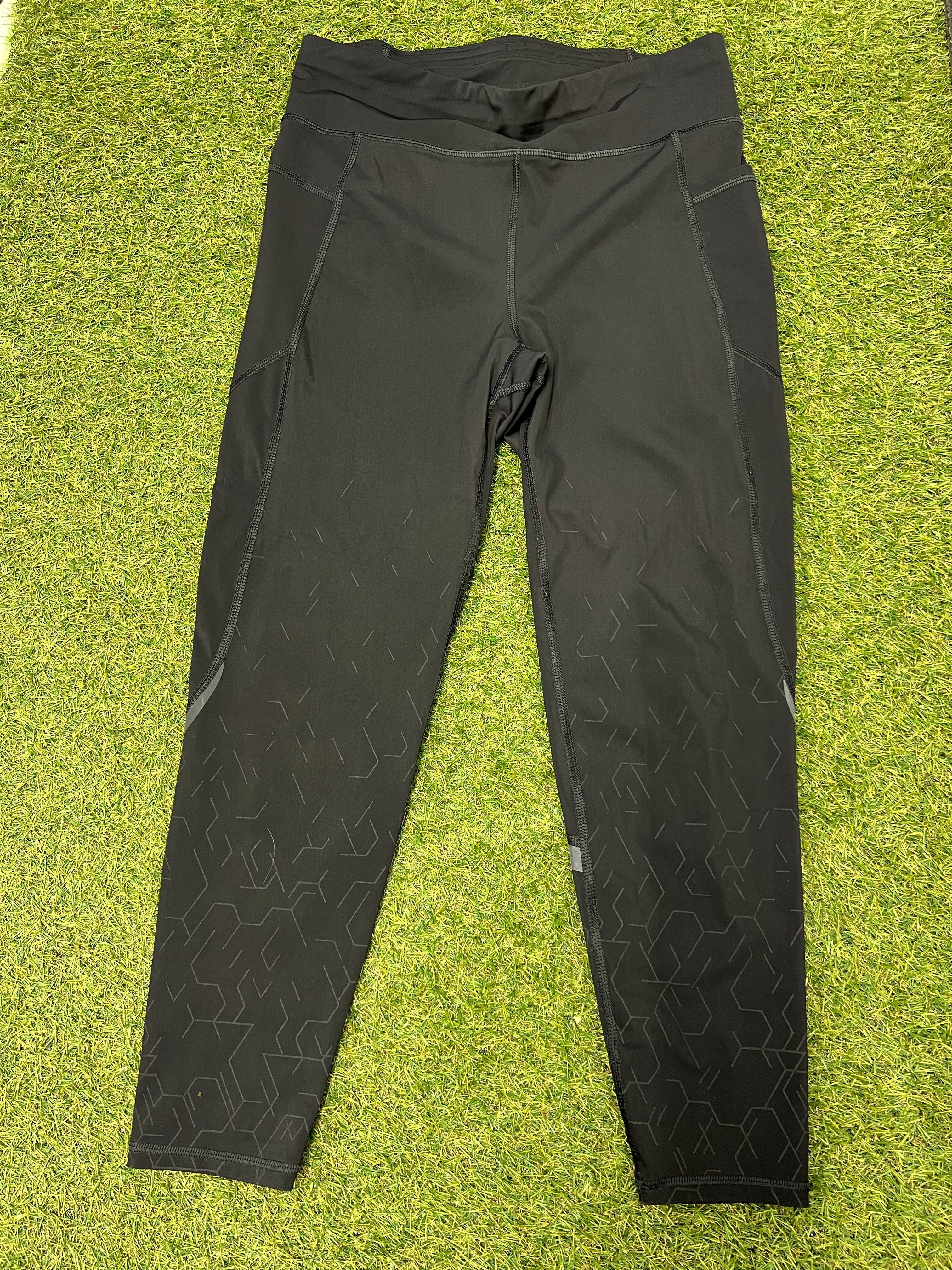 Front view of Sweaty Betty black Zero Gravity leggings with geometric grip patterns on legs
