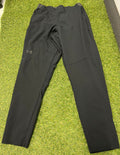 Front view of men’s Under Armour black fitted leggings laid flat on grass