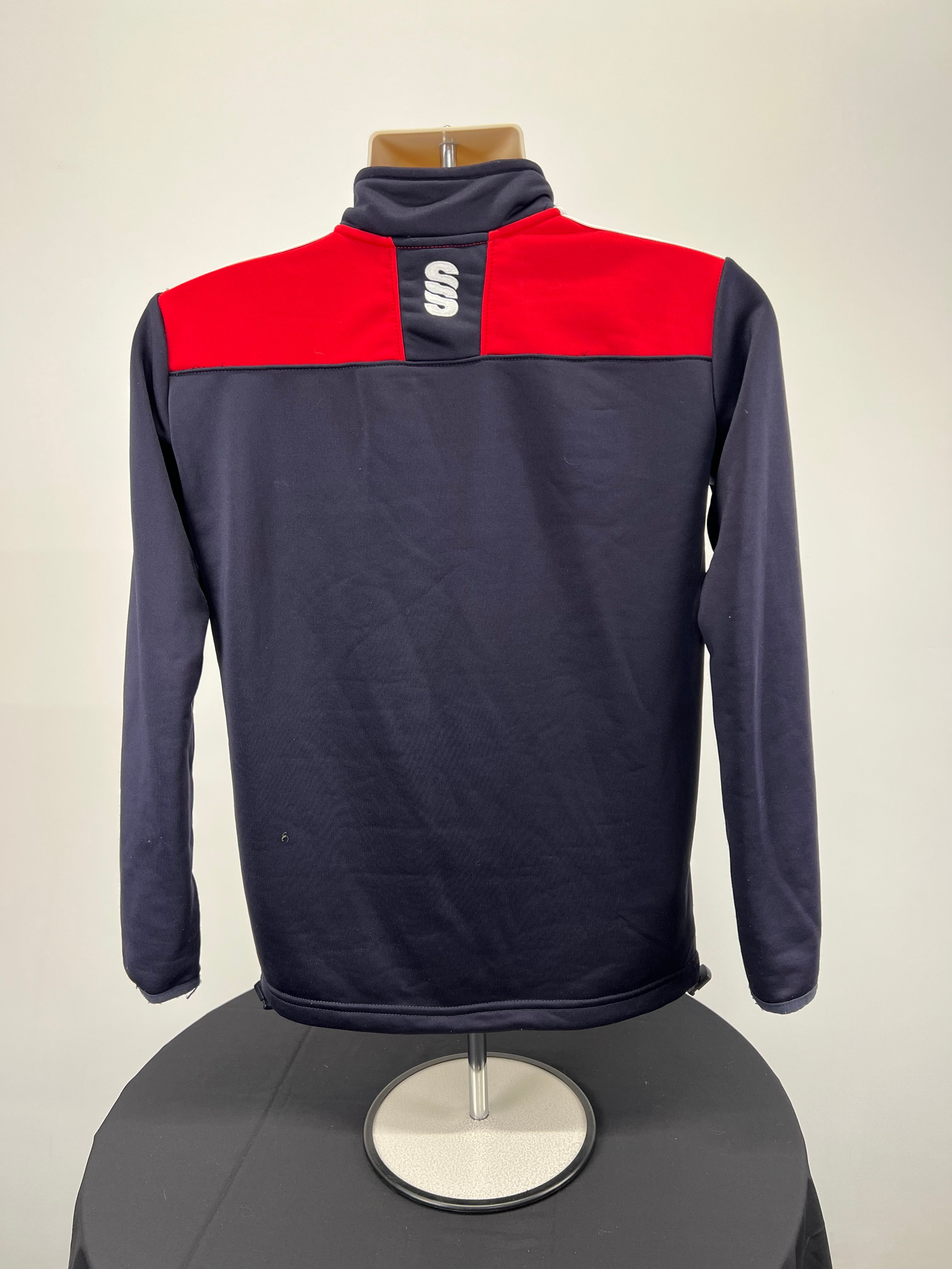 Back view of Essex Eagles half-zip top showcasing navy base with red panel and logo