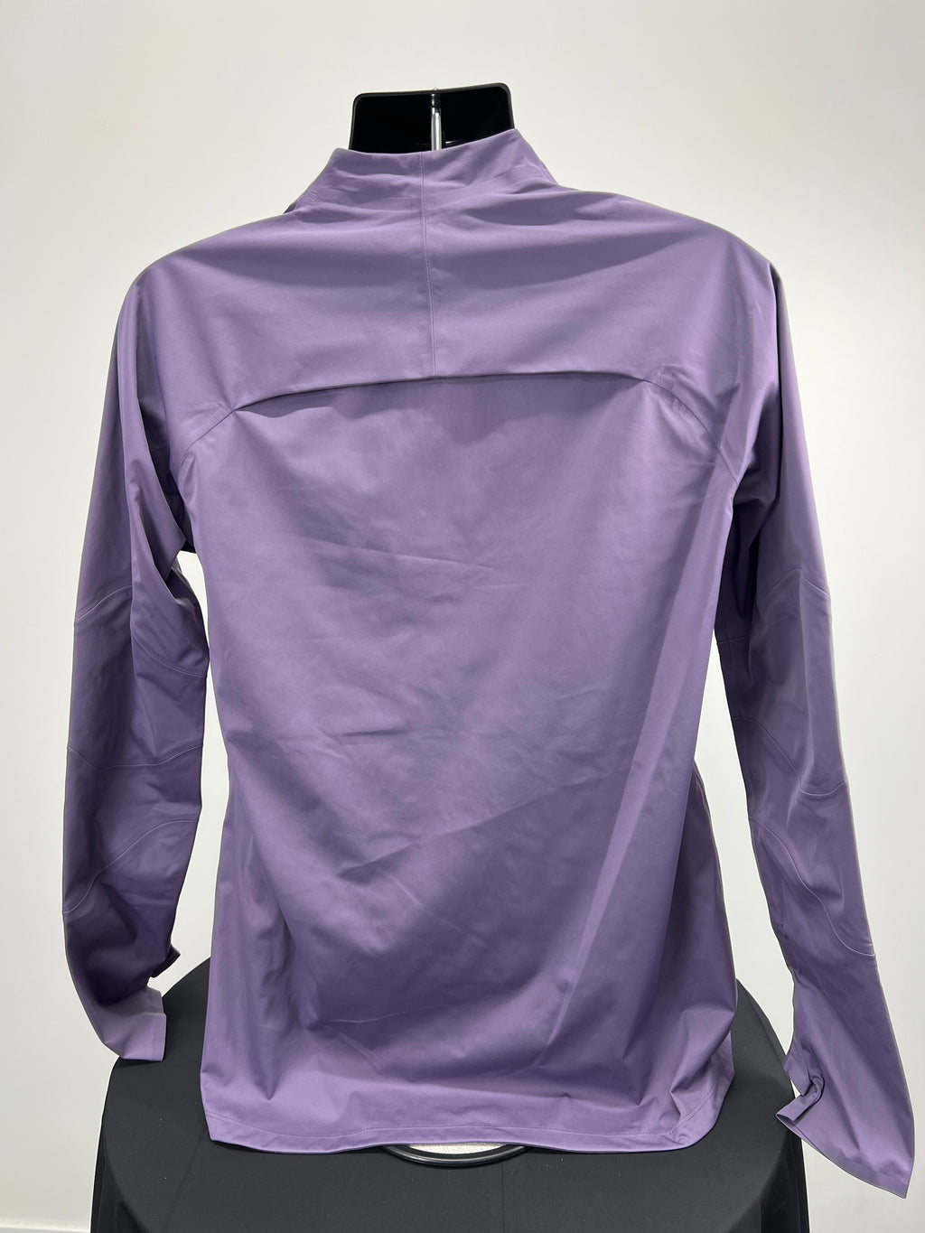 Back view of purple Nike Liverpool FC jacket showing smooth fabric and long sleeves