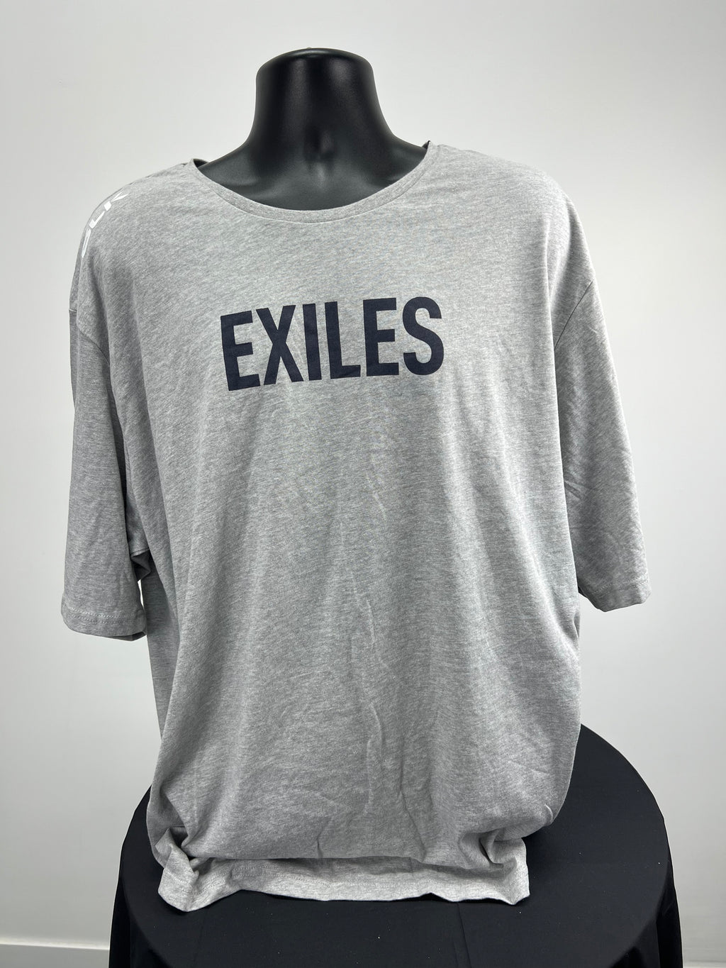 Front view of grey BLK t-shirt with bold black EXILES print
