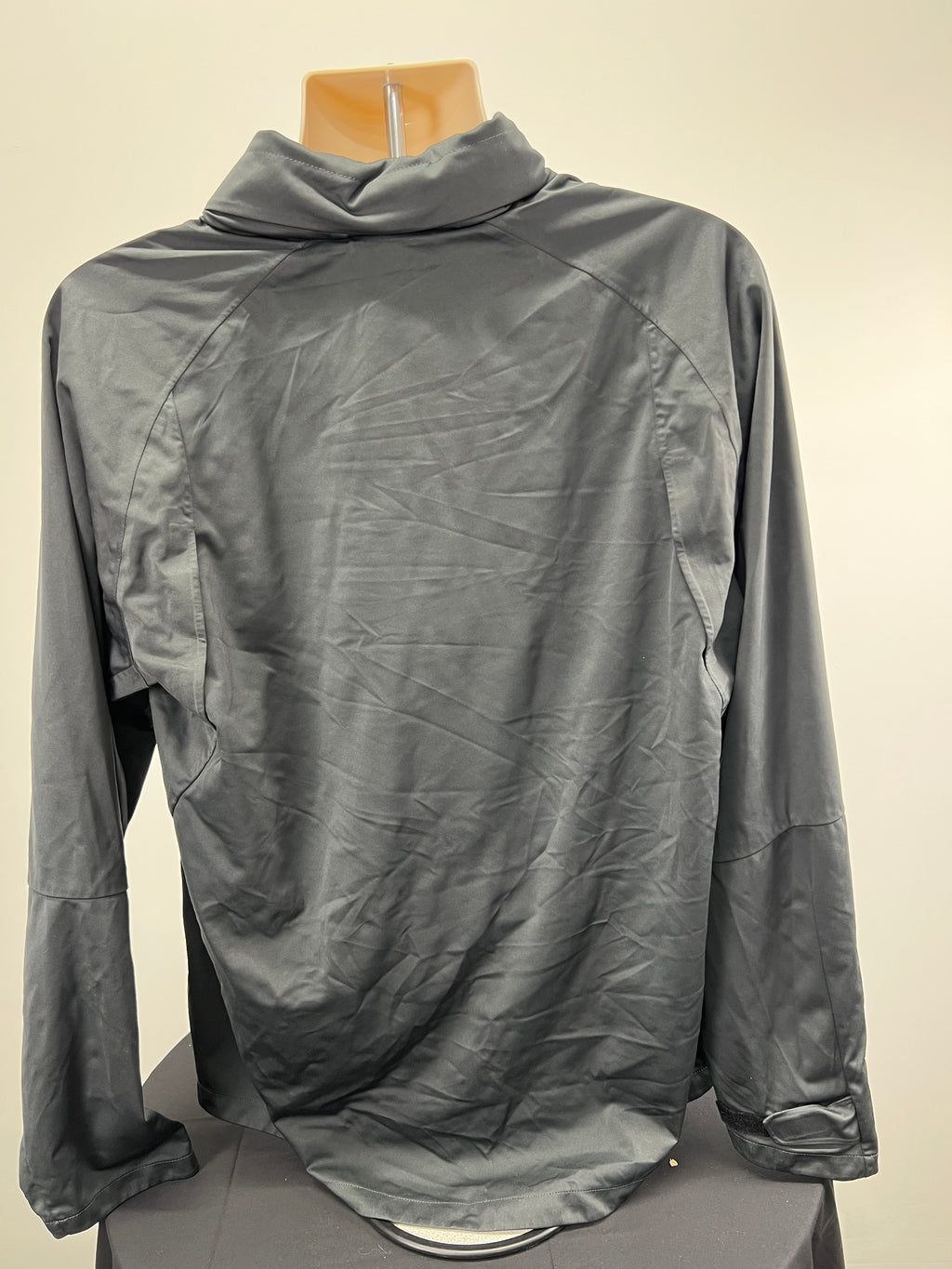 Back view of grey Nike LFC storm fit jacket with long sleeves and high collar