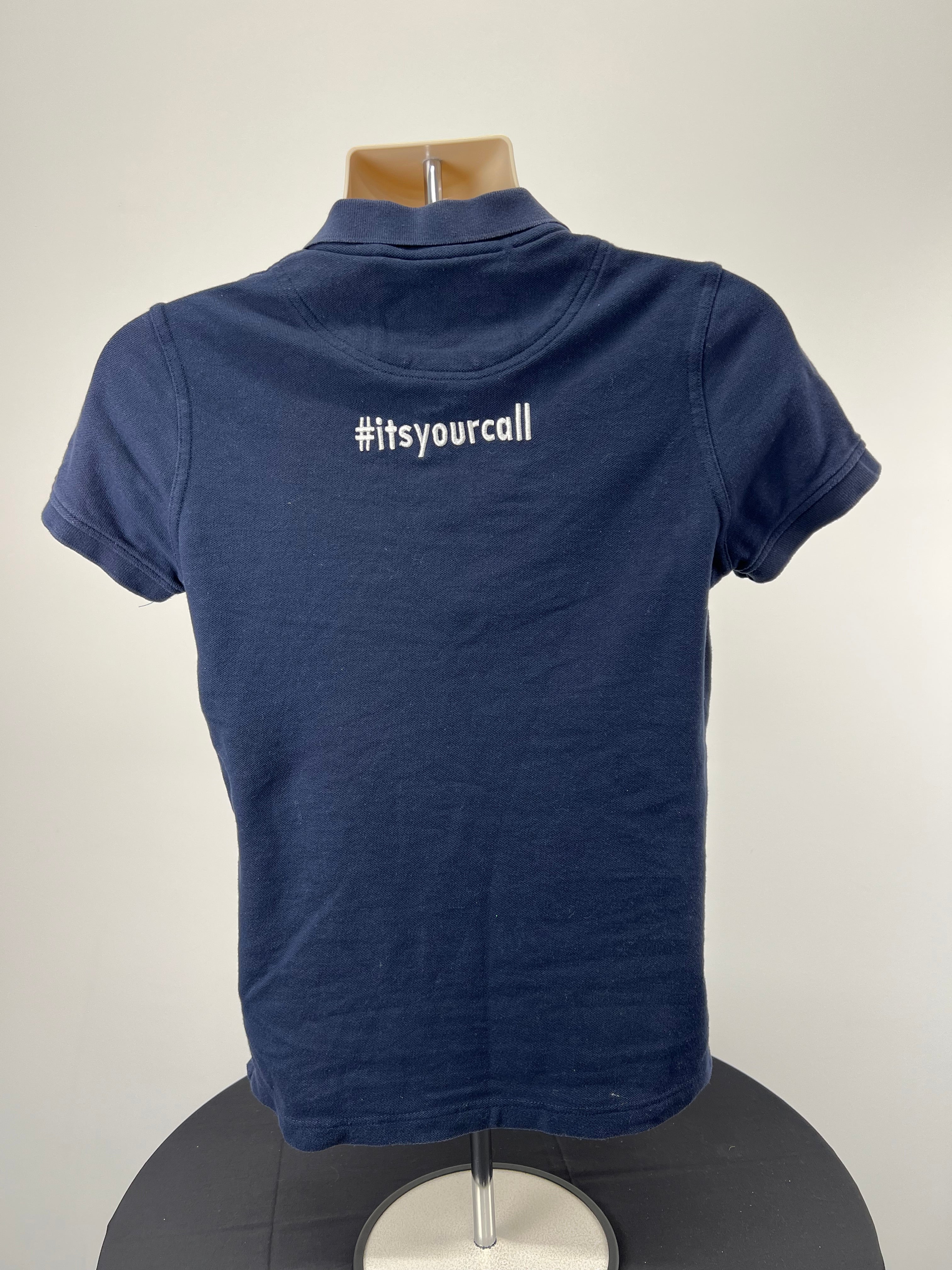 Back view of dark blue polo shirt showing #itsyourcall embroidery