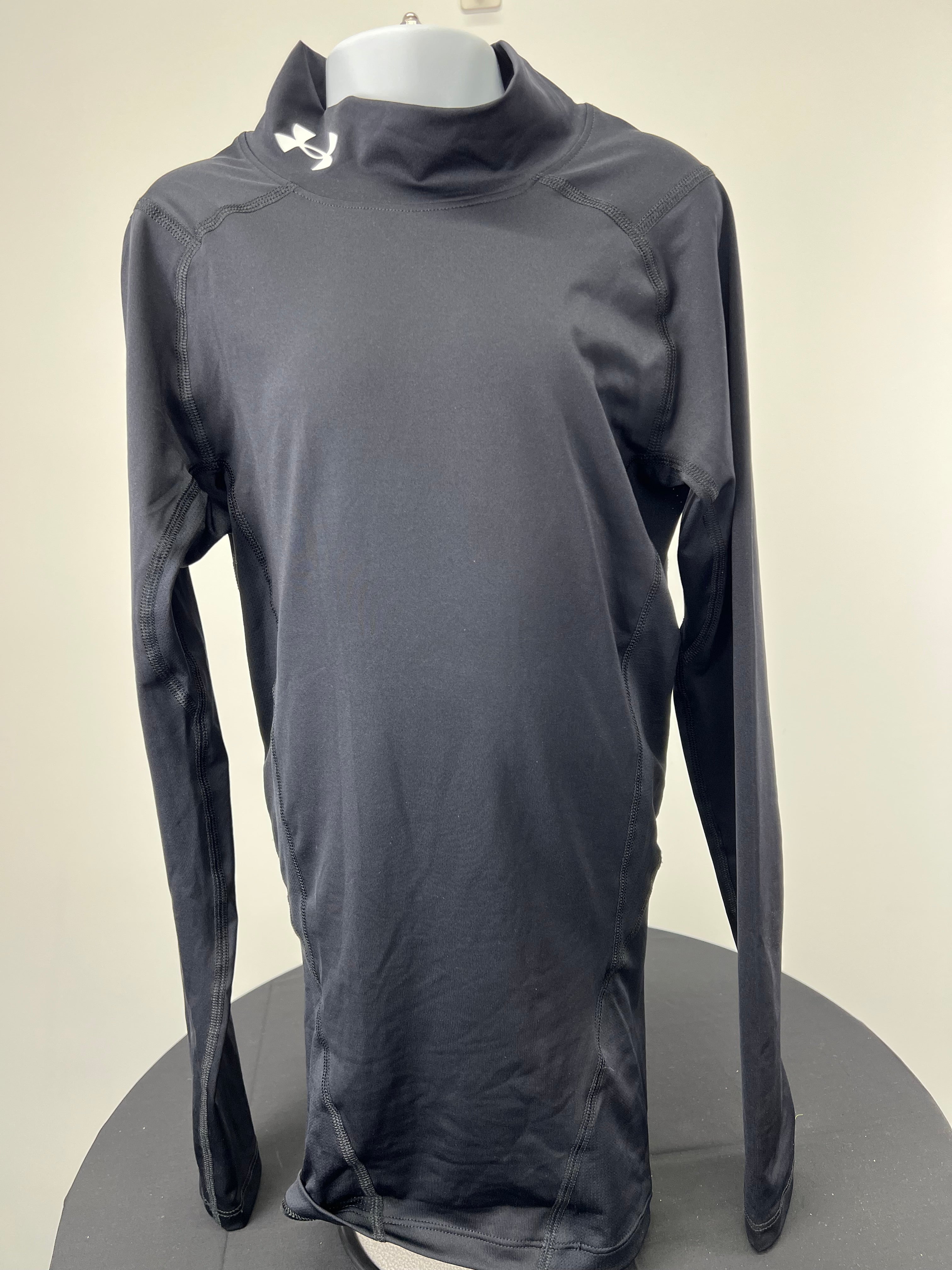 Front view of black Under Armour compression long-sleeve top with high collar and logo on neck