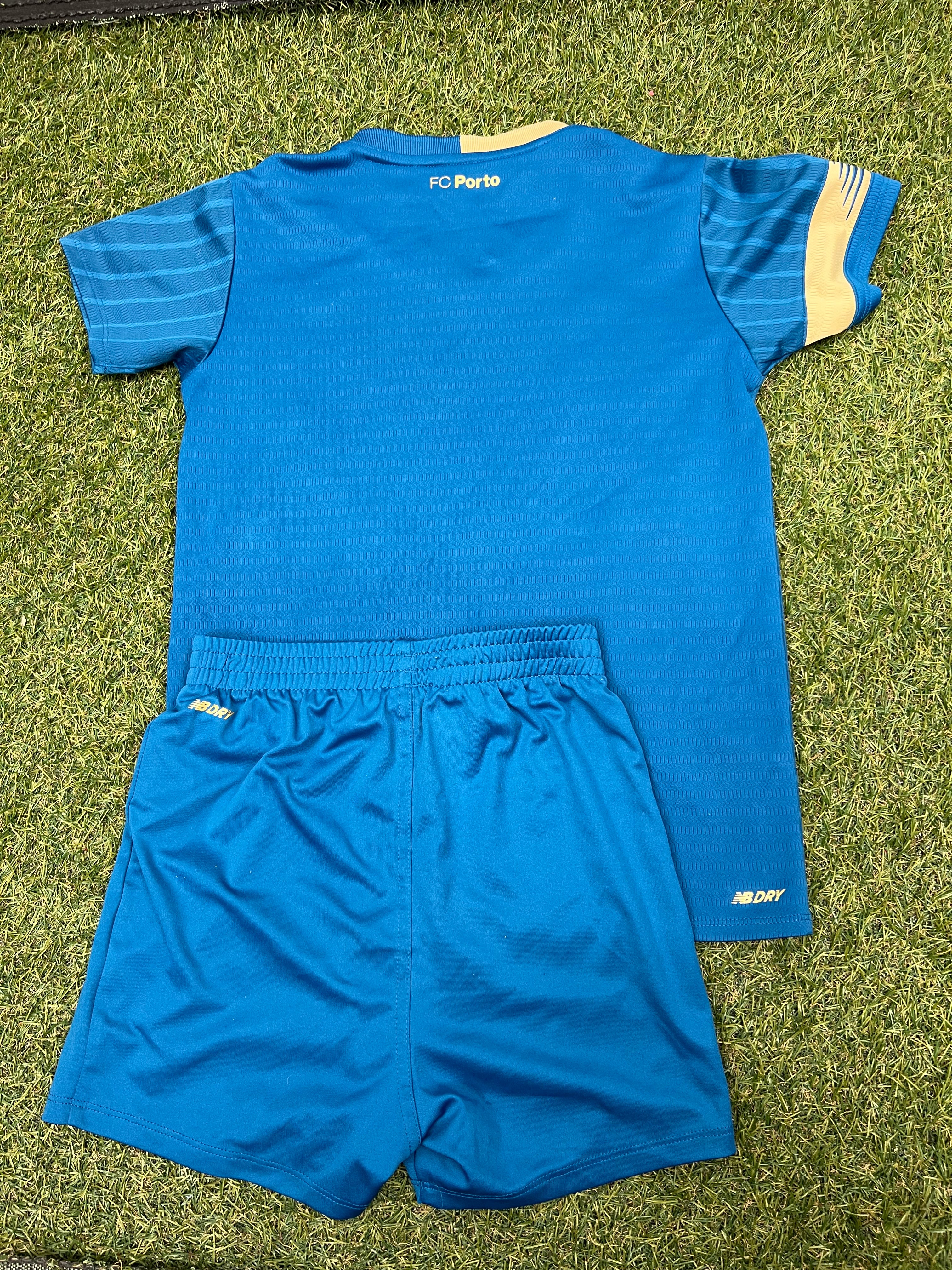 Back view of kids FC Porto football strip showing plain blue jersey with FC Porto label and elasticated waist shorts