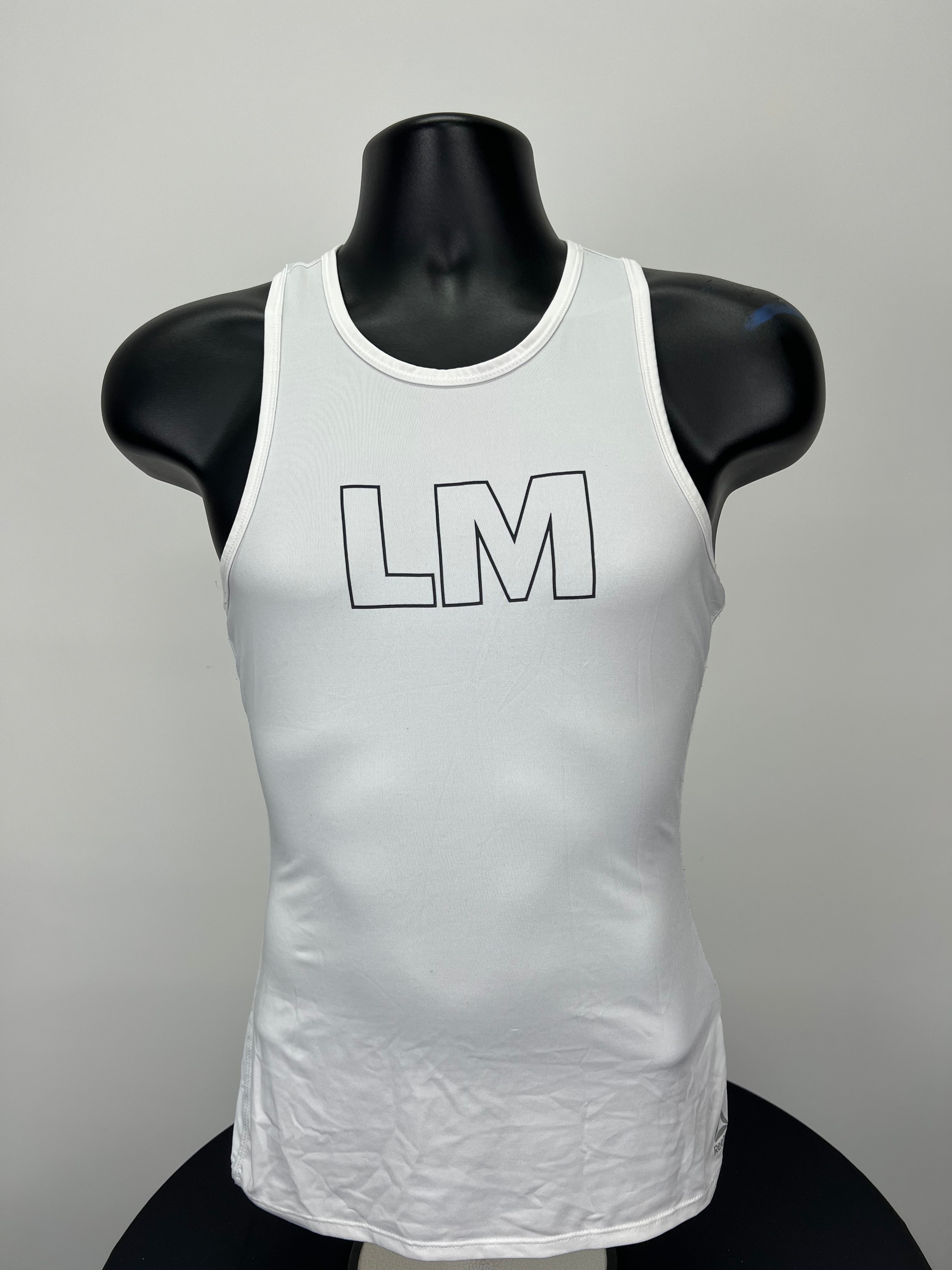 Front view of white Women’s Reebok Les Mills sports vest with LM logo