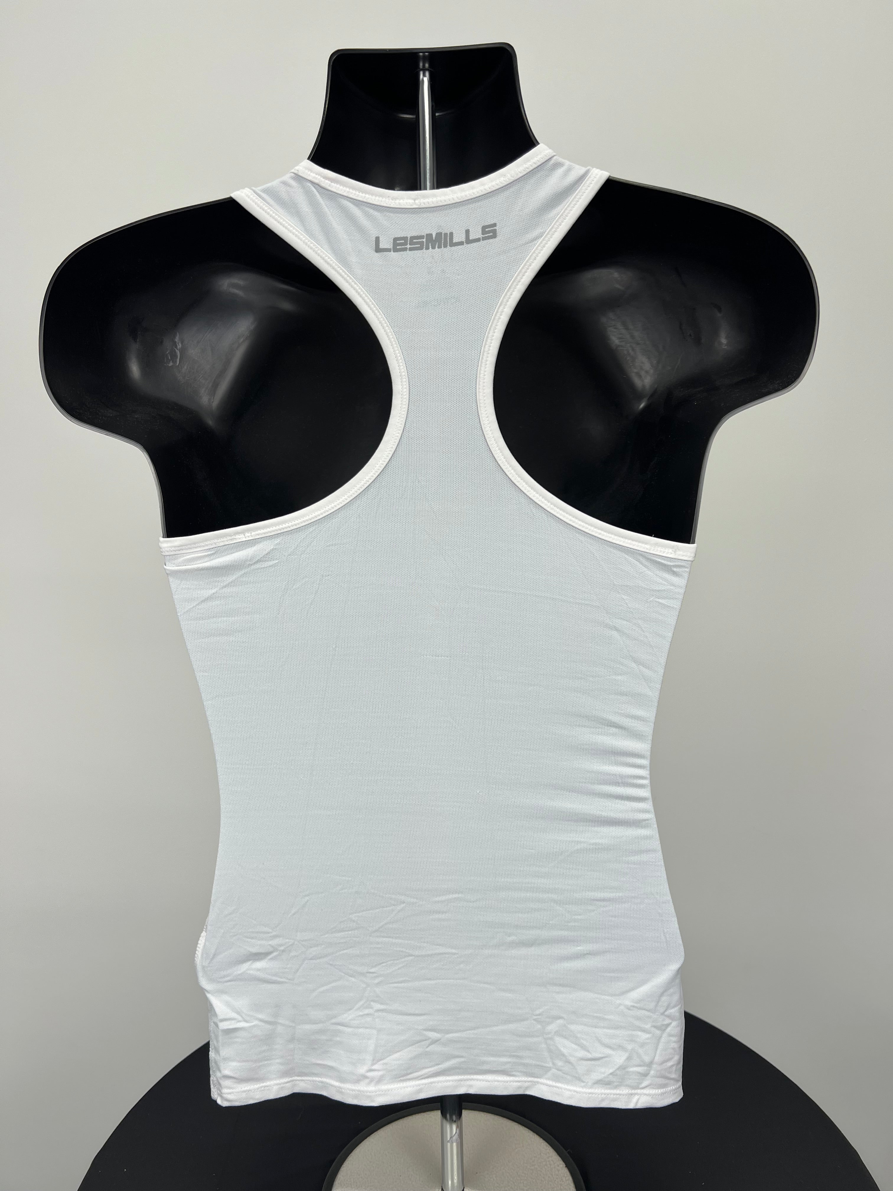 Back view of white racerback Women’s Reebok Les Mills sports vest