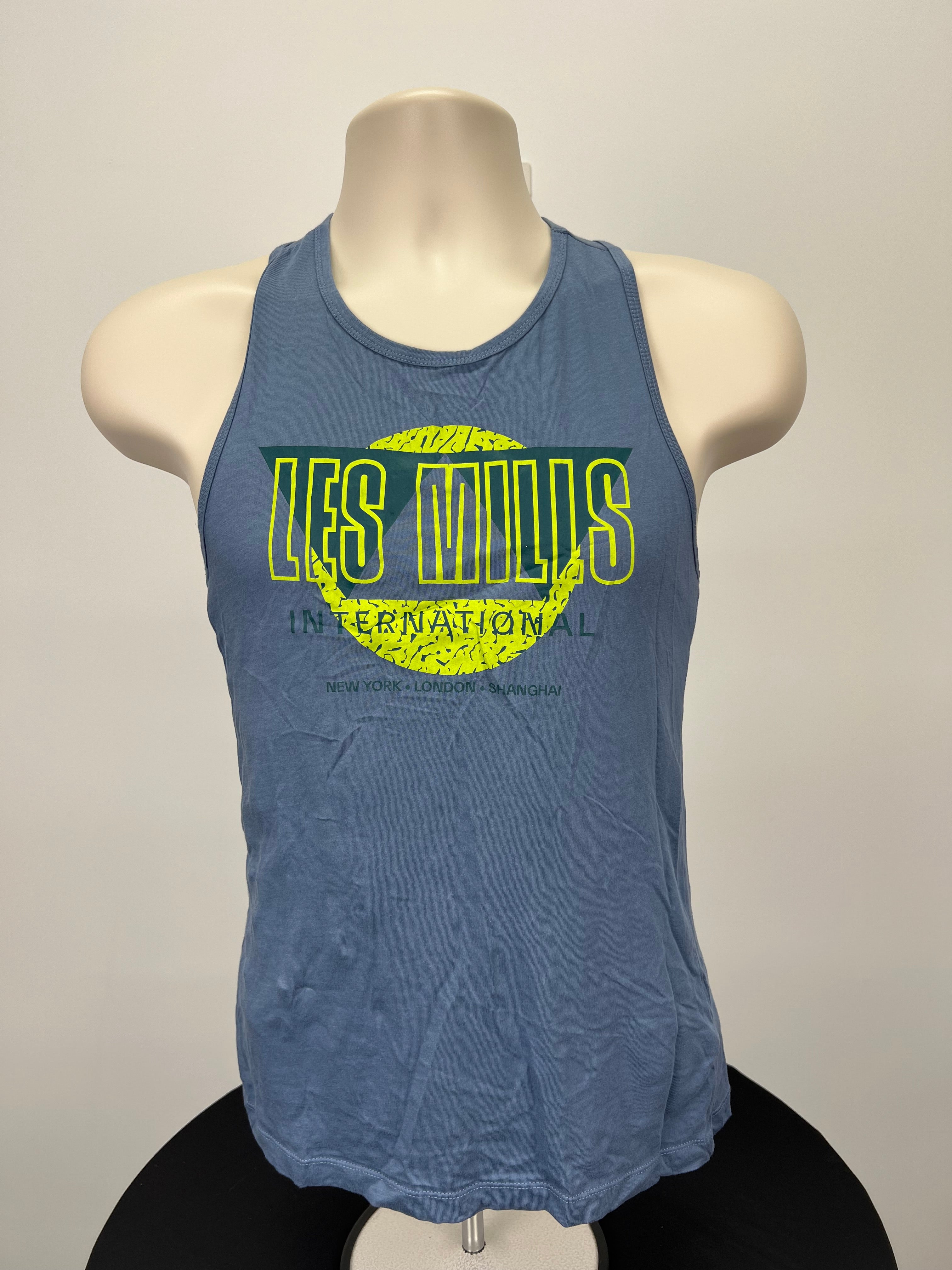 Front view of Reebok x Les Mills grey vest top with bright yellow and green logo pattern