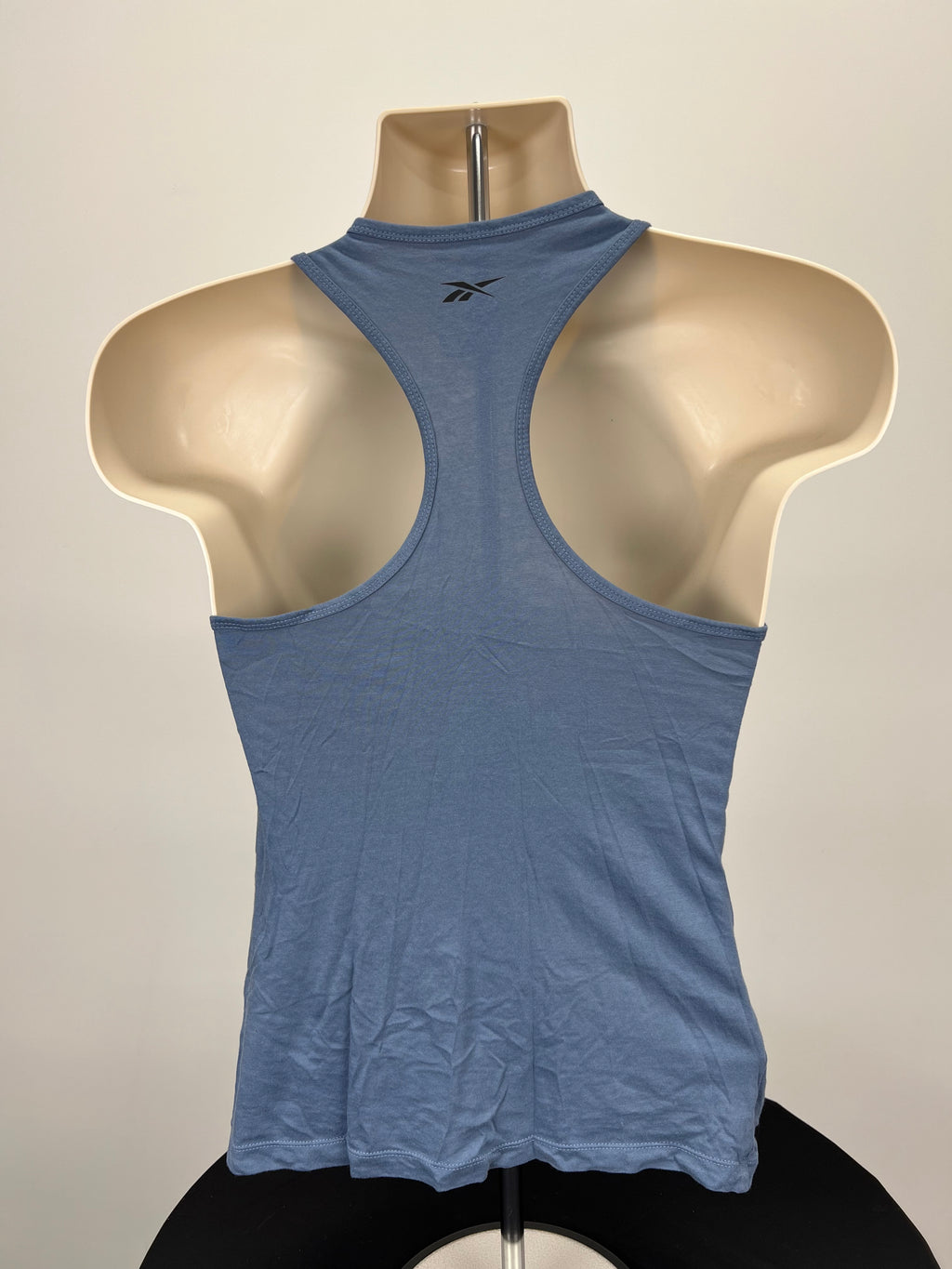 Back view of Reebok x Les Mills grey racerback vest top with small Reebok logo