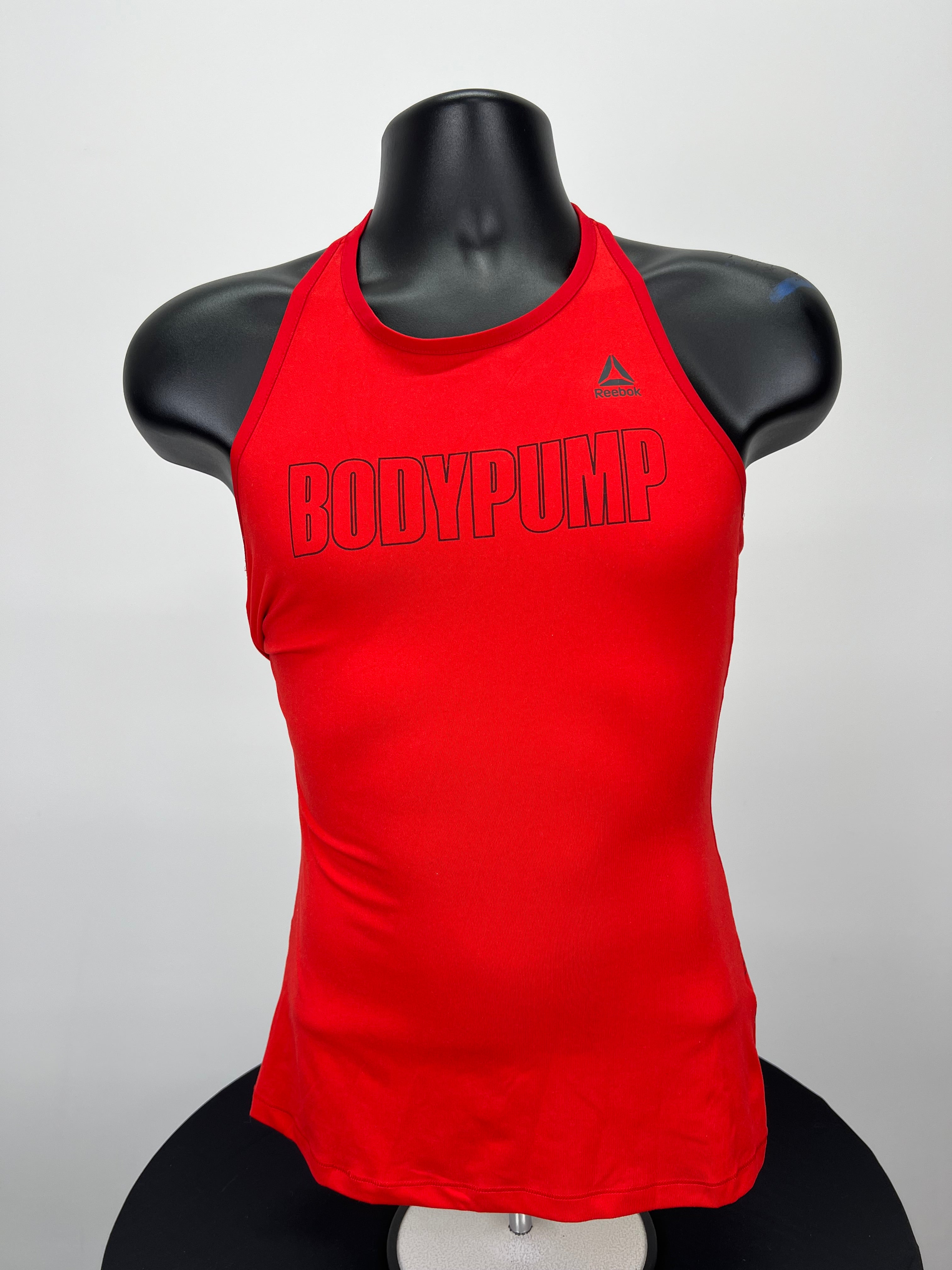 Front view of red Reebok Body Pump vest top on mannequin
