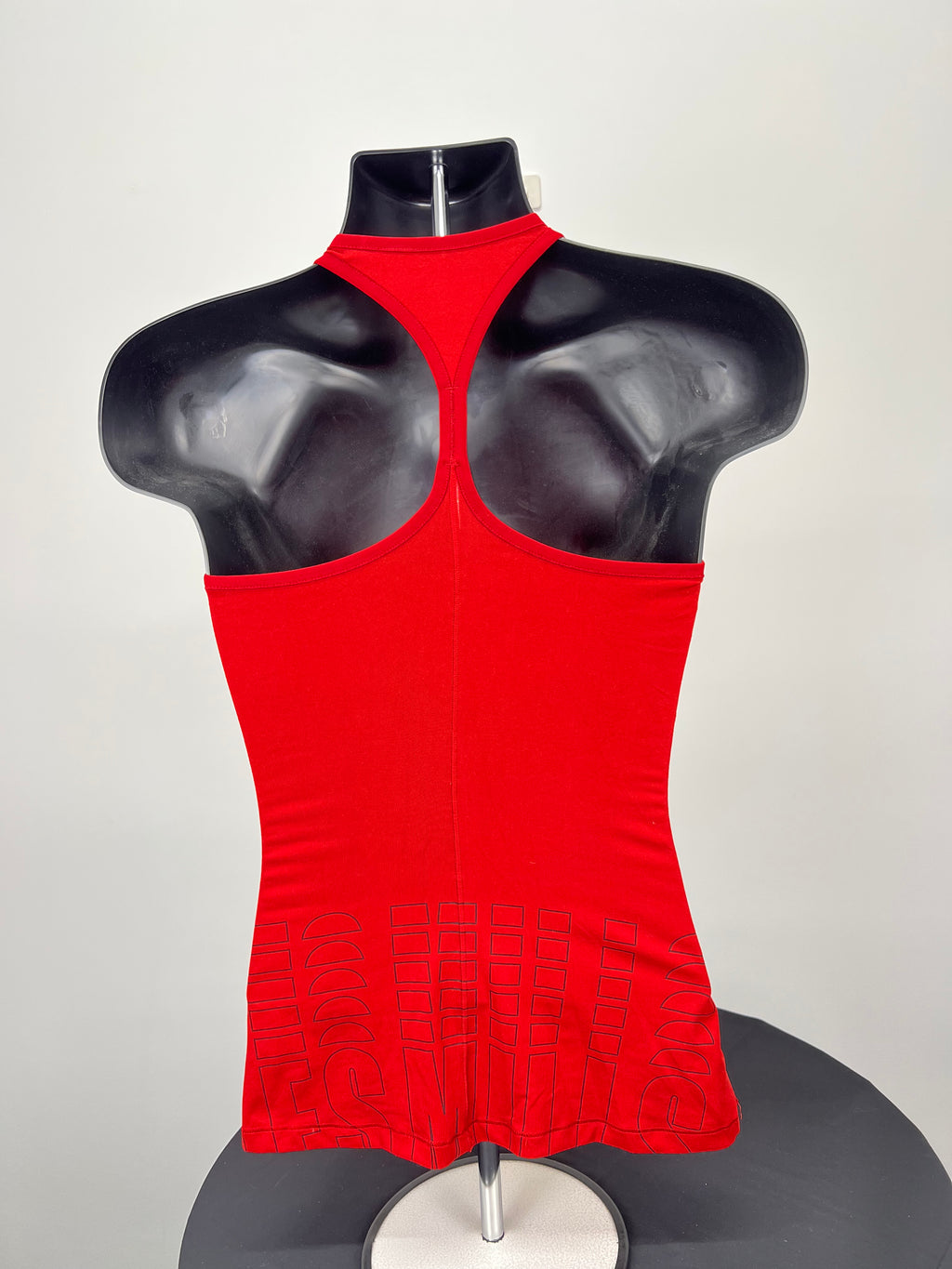 Back view of red Reebok Body Pump racerback vest top on mannequin