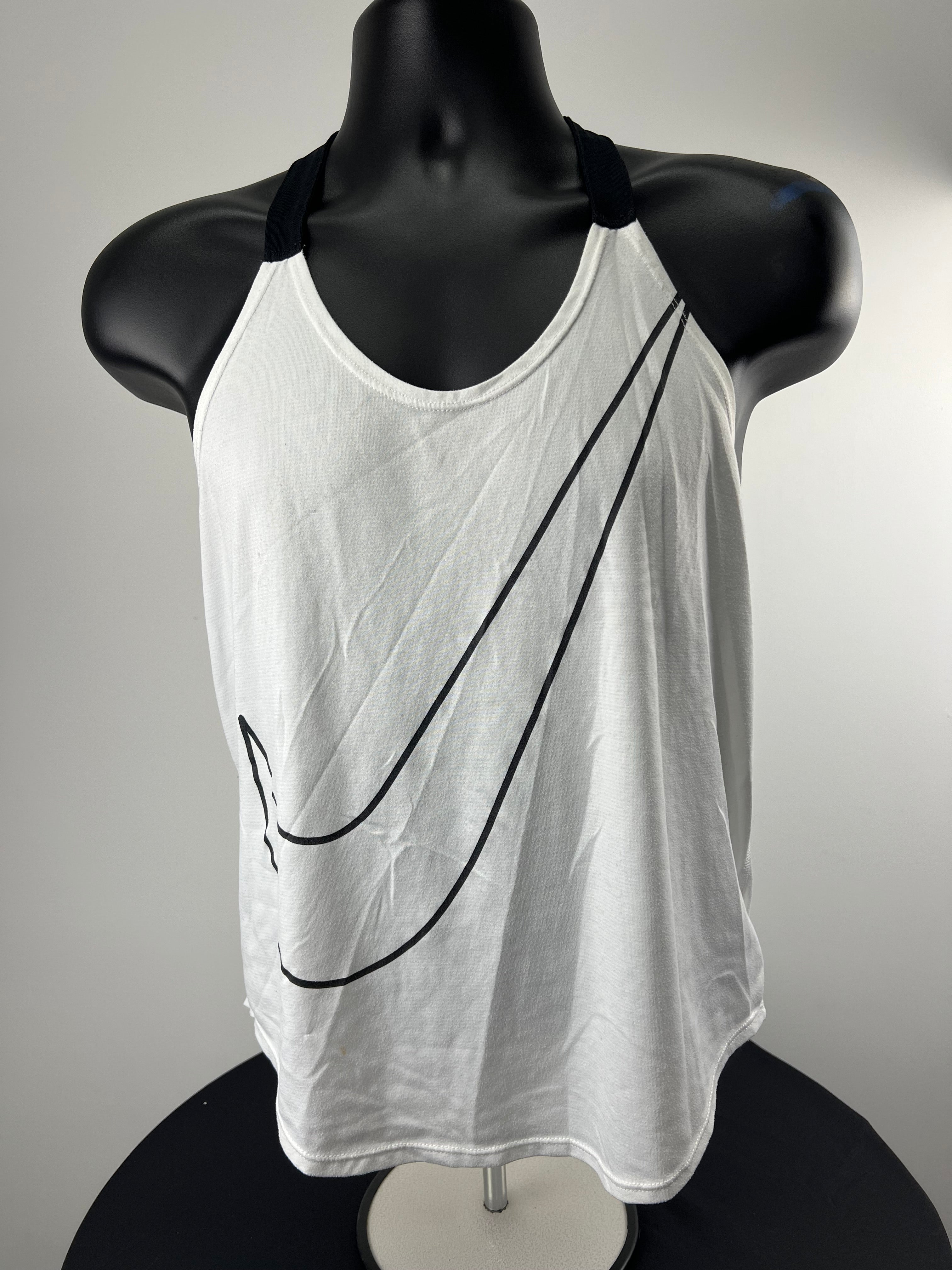 Front view of Nike white vest top with large black swoosh logo on front