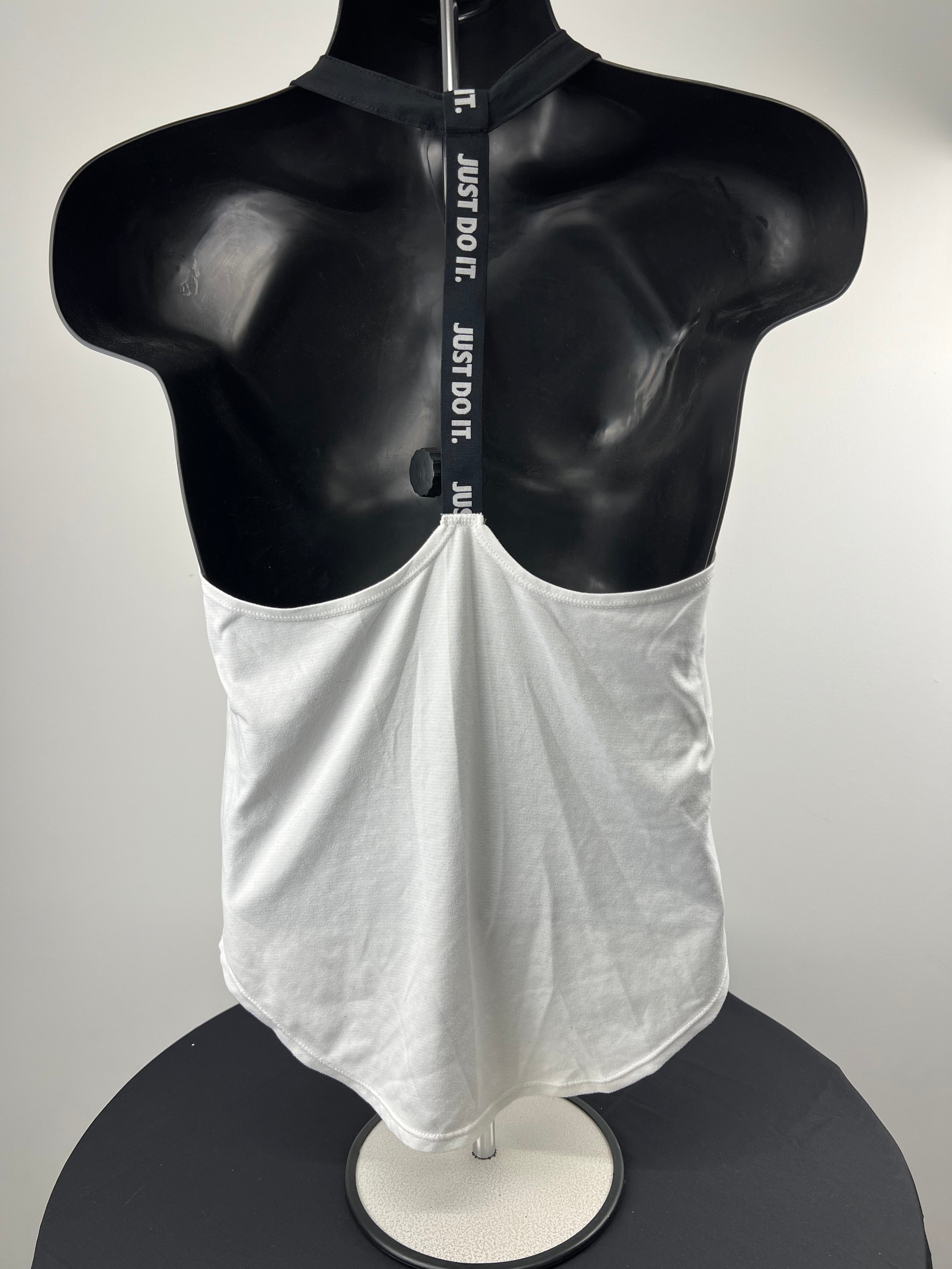 Back view of Nike vest top showing black strap with 'JUST DO IT.' text and open back design