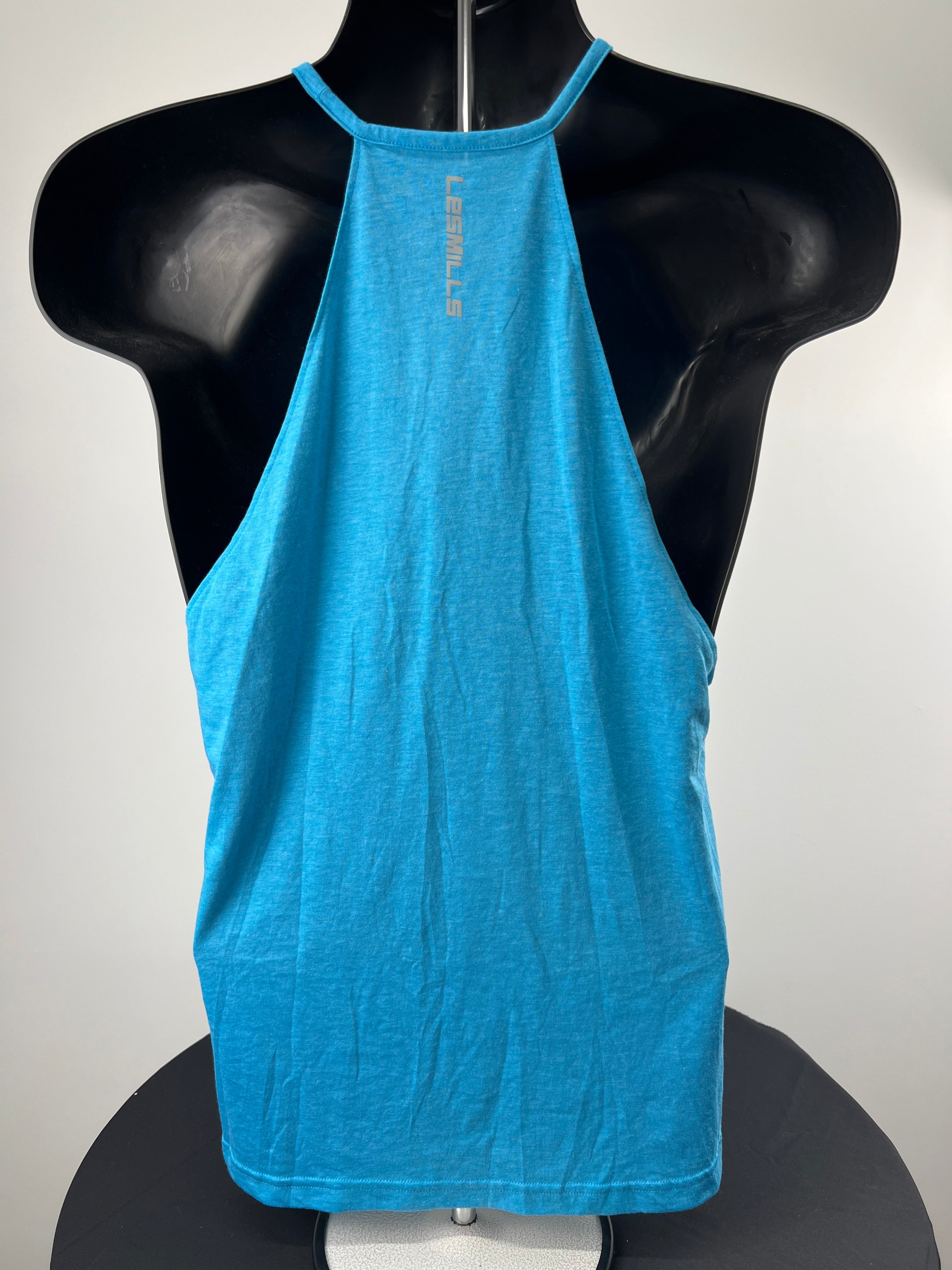 Back view of turquoise Reebok Les Mills training vest with racerback design on mannequin