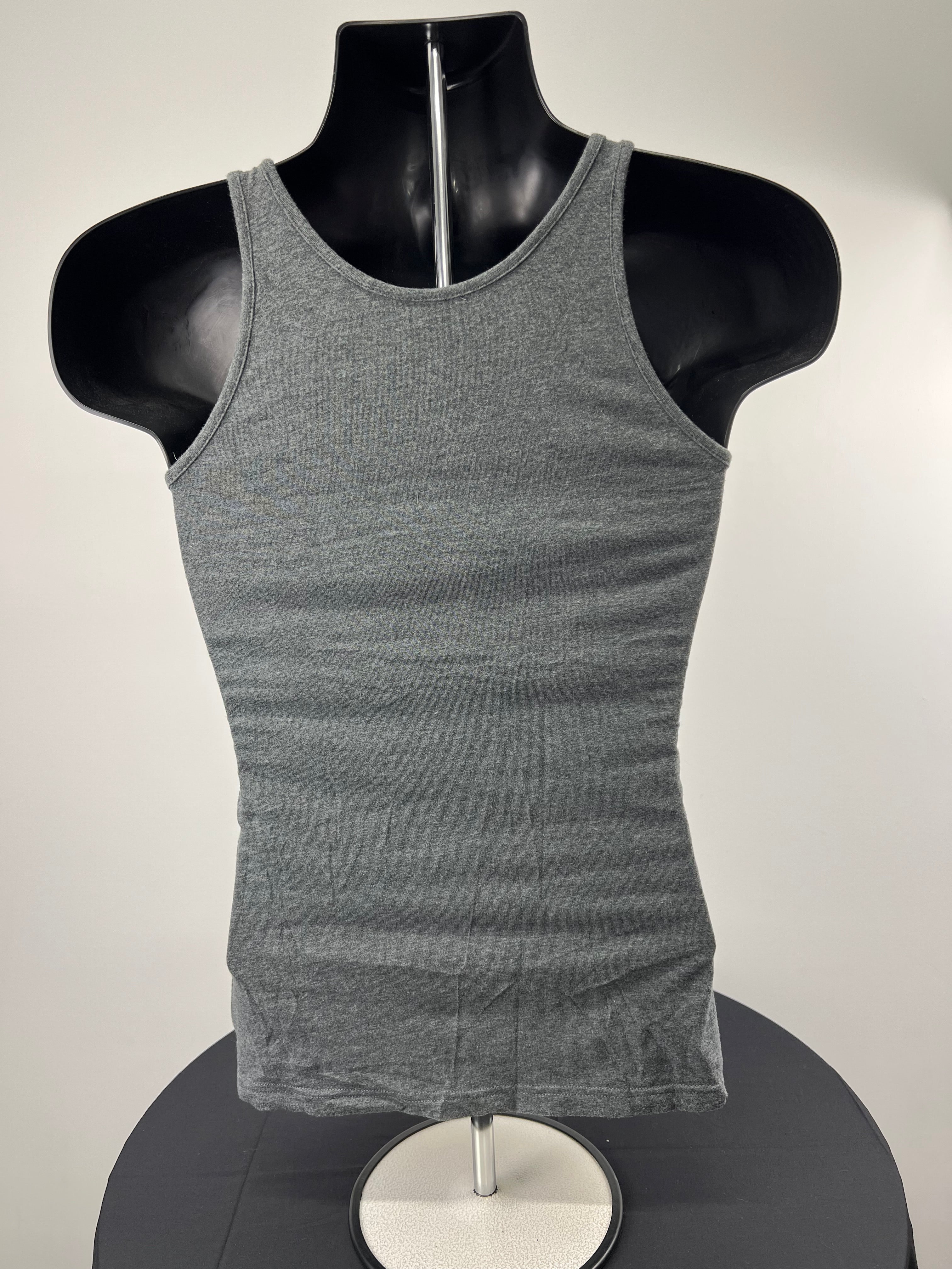 Back view of women's adidas grey training vest showing racerback design on black mannequin