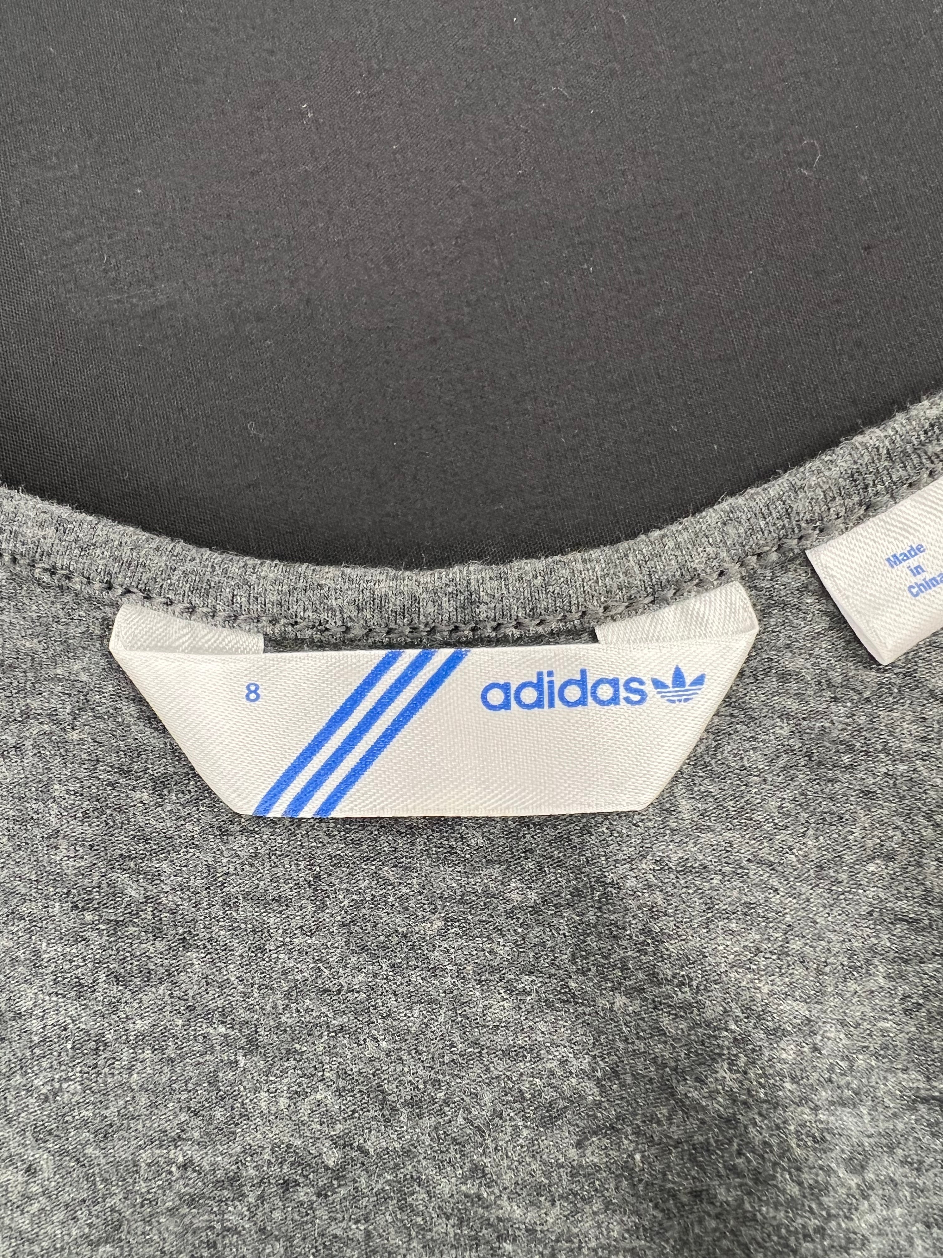 Close-up of adidas size 8 label inside grey training vest