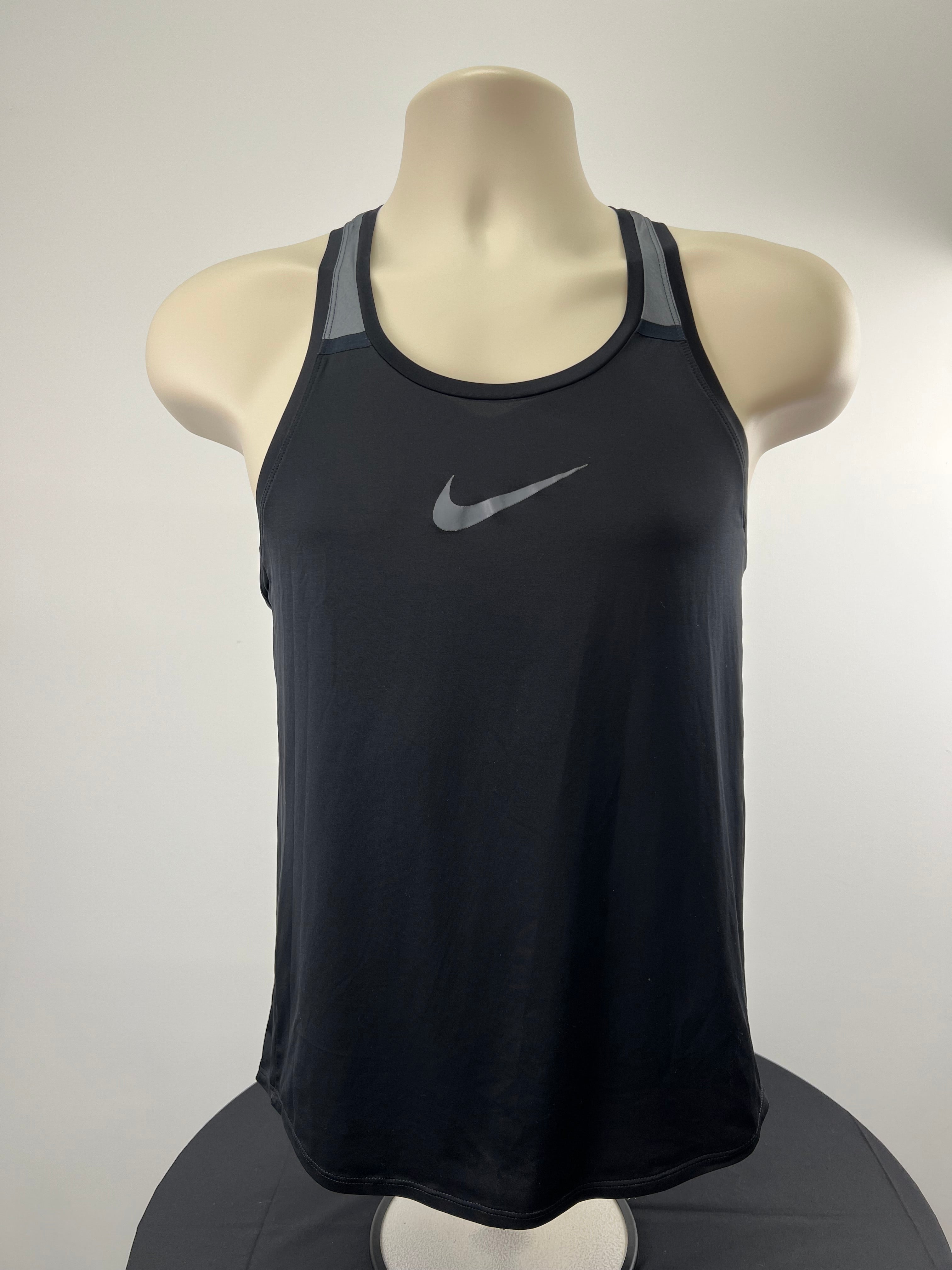 Front view of black Nike Dri-FIT vest with grey Nike swoosh logo