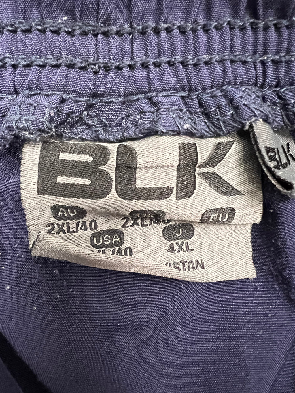 Close-up of the label inside the BLK London Irish shorts showing size 2XL and brand details