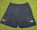 Front view of black England Rugby shorts with England rose logo and O2 Touch branding on a grass background