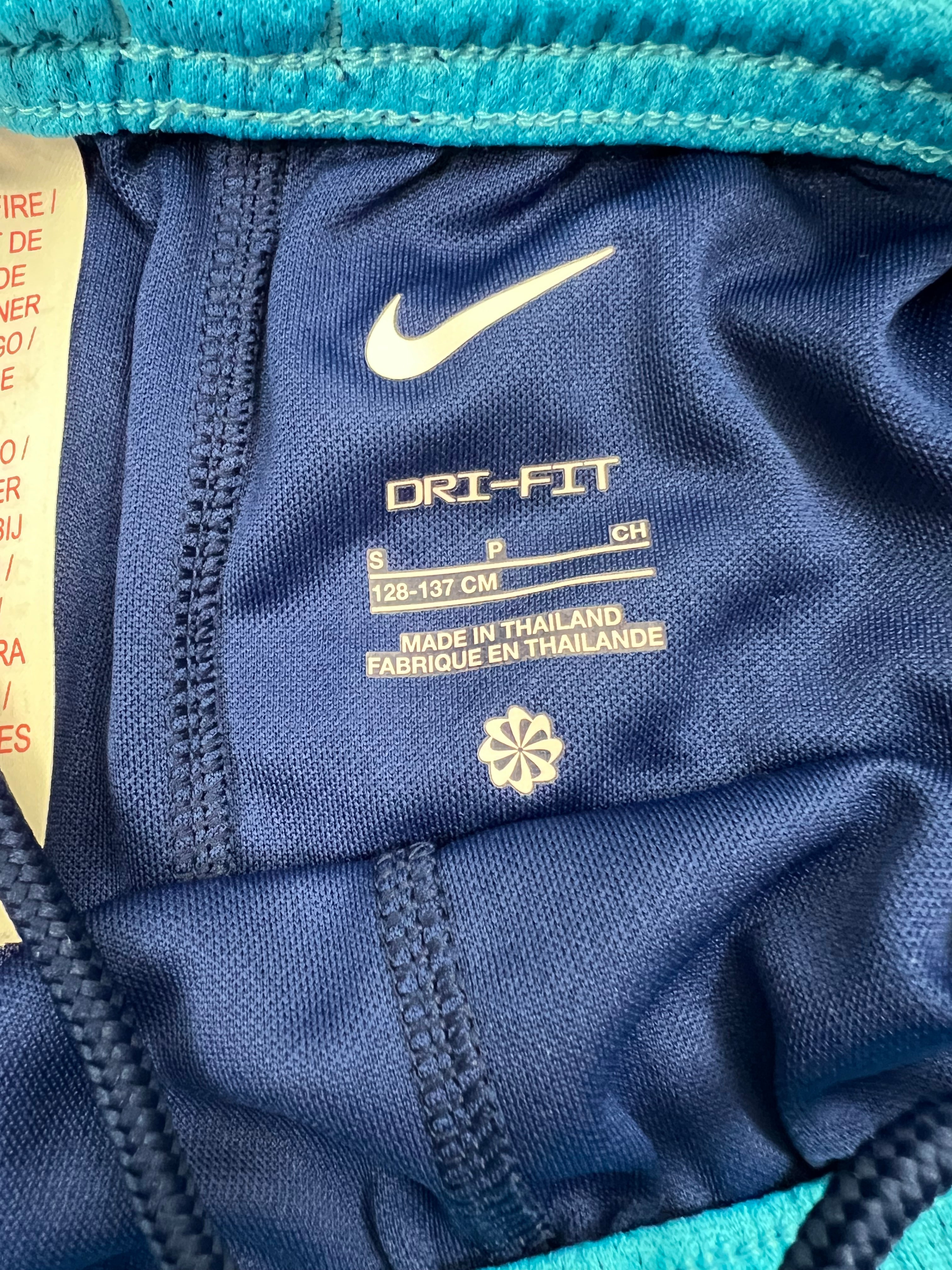 Close-up of inner label showing Nike logo, Dri-FIT fabric detail and size information