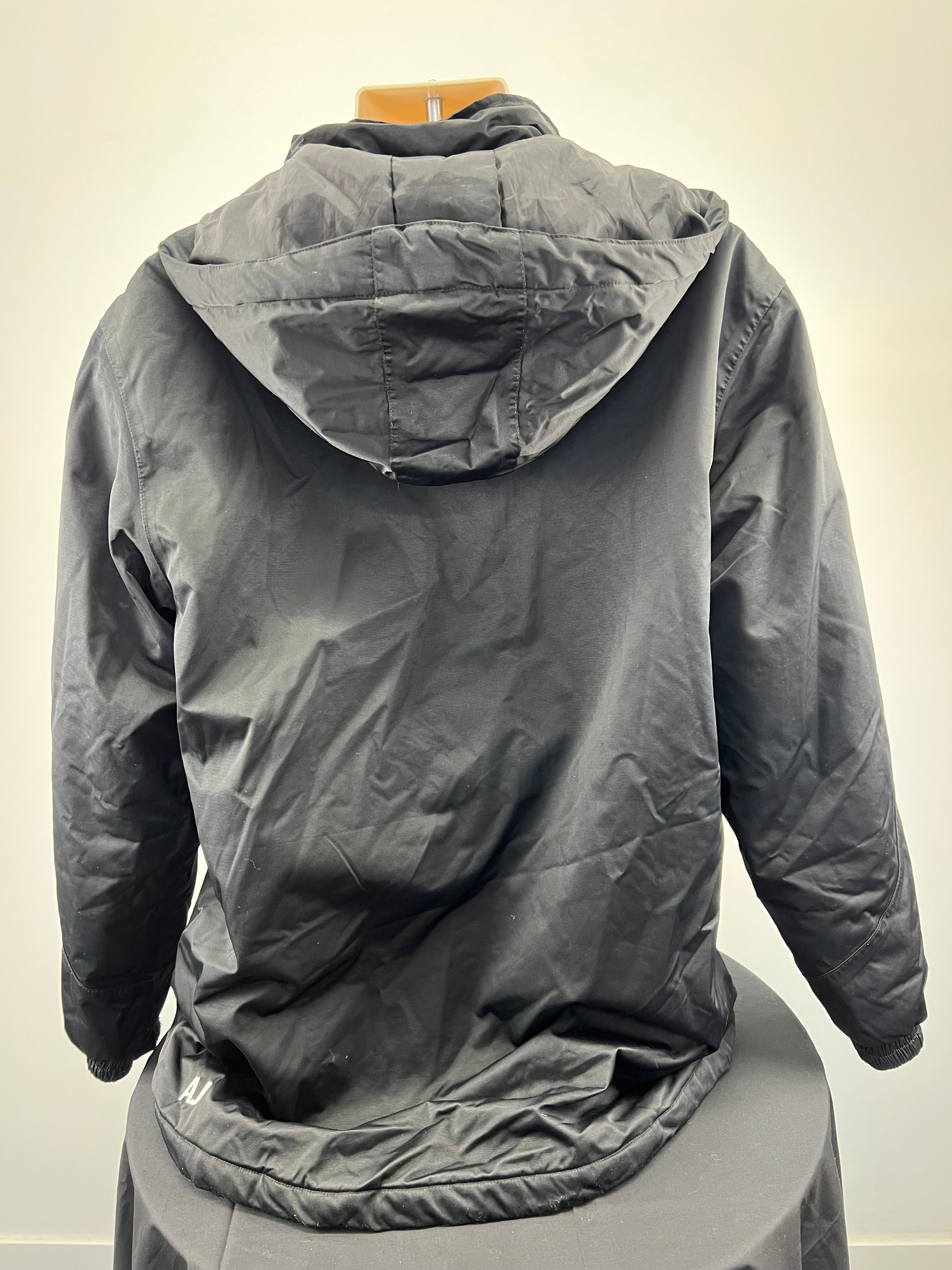 Back view of men’s black hooded jacket showing hood and elasticated hem