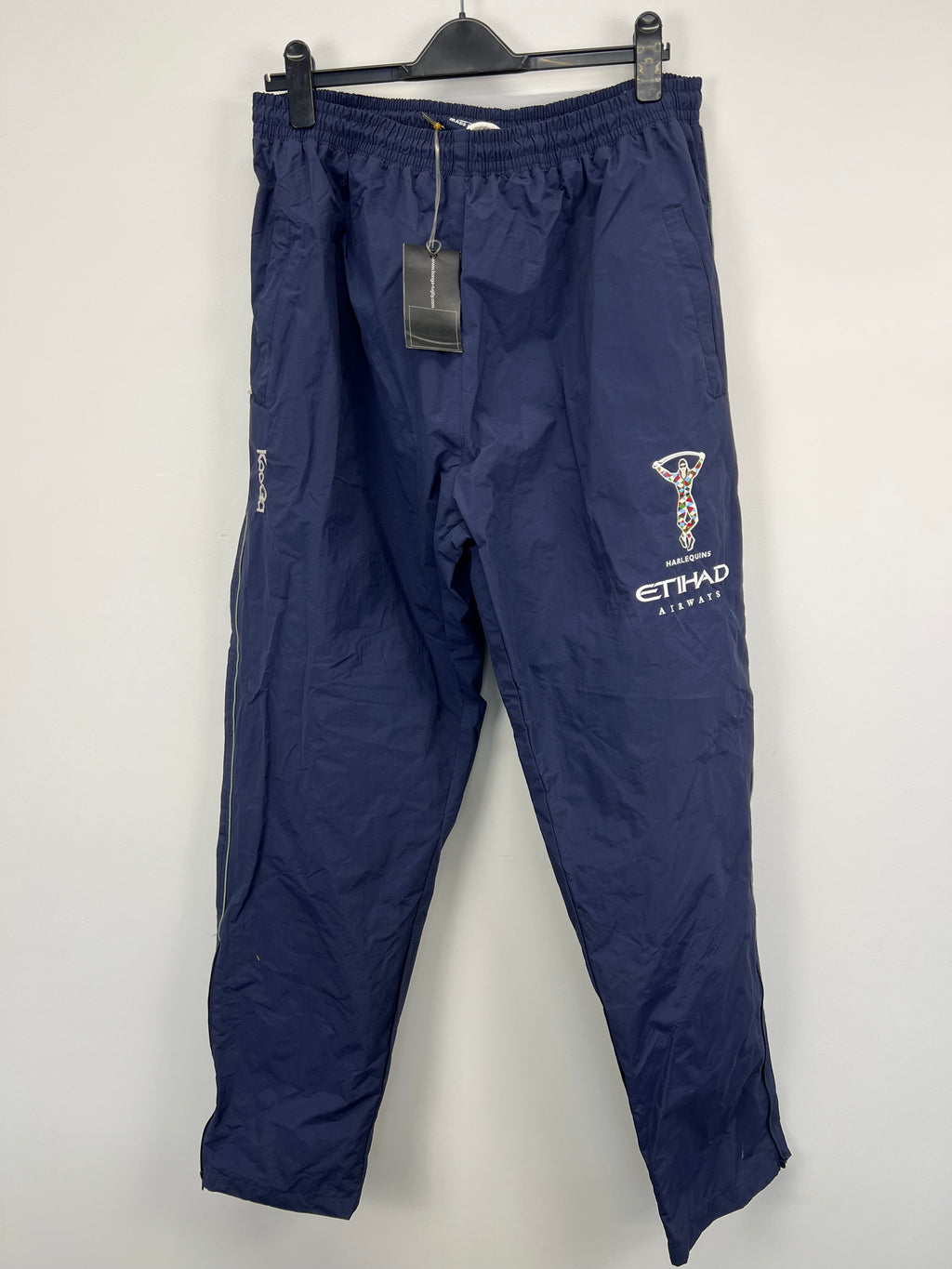 Harlequin rugby club dark blue tracksuit bottoms front view hanging on black hanger
