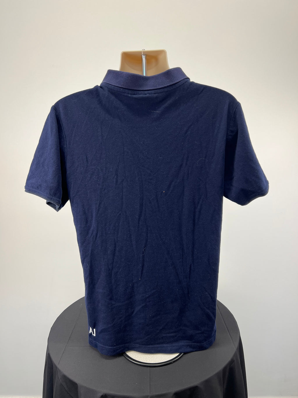 Back view of Men’s BLK London Irish rugby club navy blue polo top showing plain back design