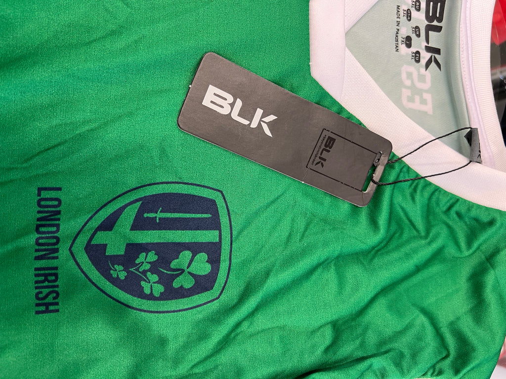 Close-up of London Irish crest and BLK brand tag on green rugby sleeveless training top