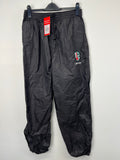 Men’s London Irish black waterproof rugby trousers front view hanging on clip hanger