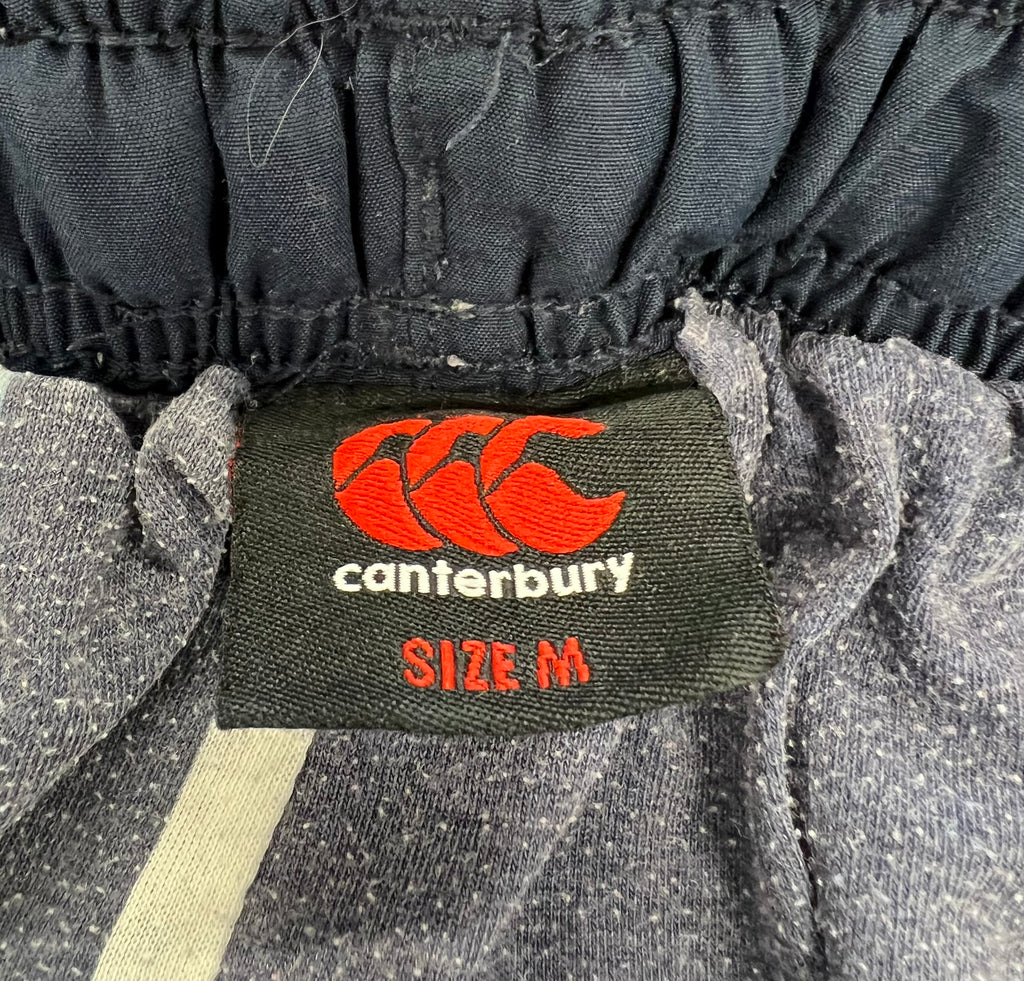 Close-up of Canterbury brand label inside the waistband showing size medium