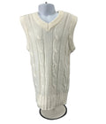 Front view of kids cream coloured cable knit sleeveless Slazenger cricket pullover