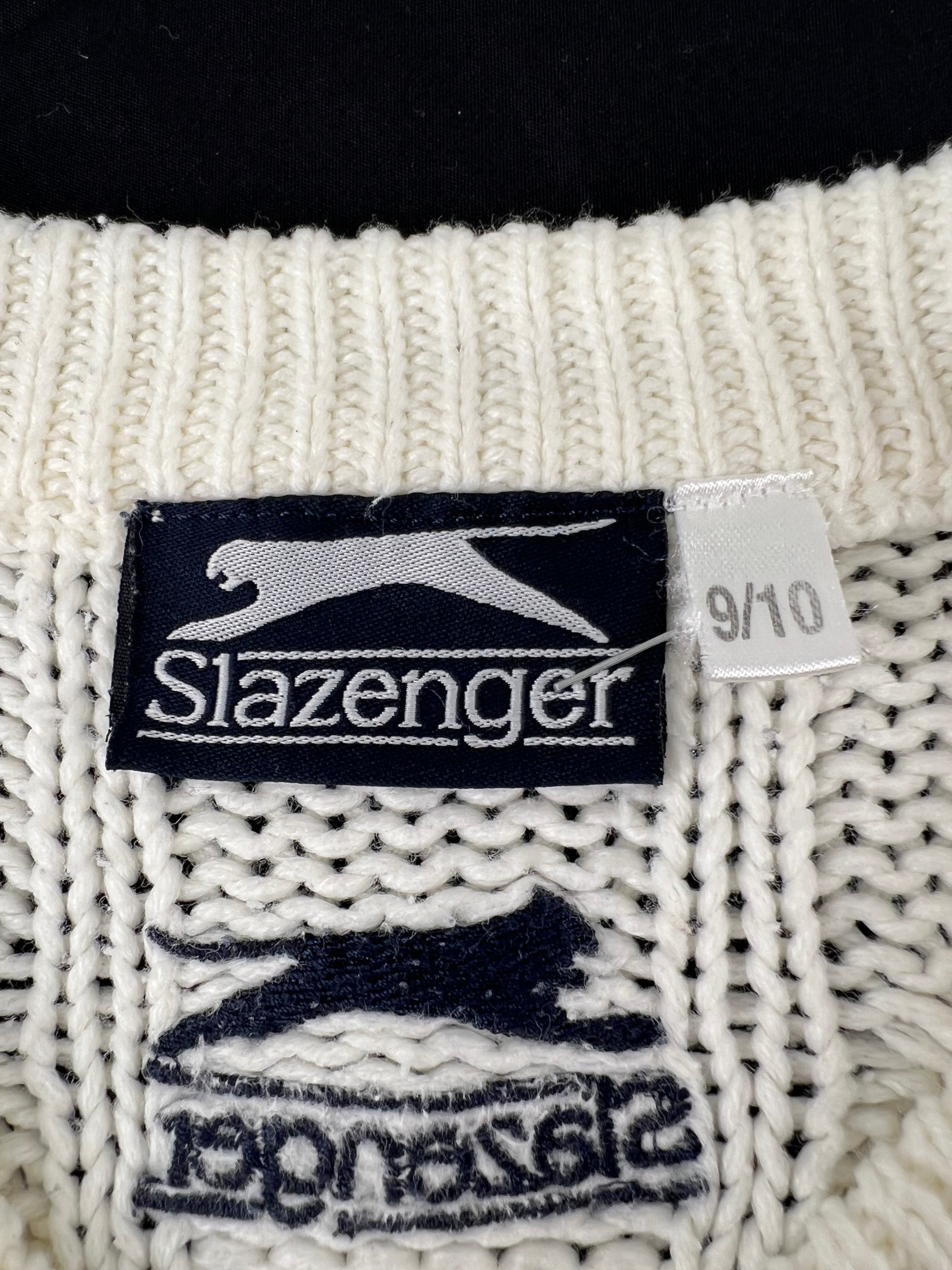 Close-up of Slazenger label and size 9-10 tag on cream cable knit sleeveless pullover
