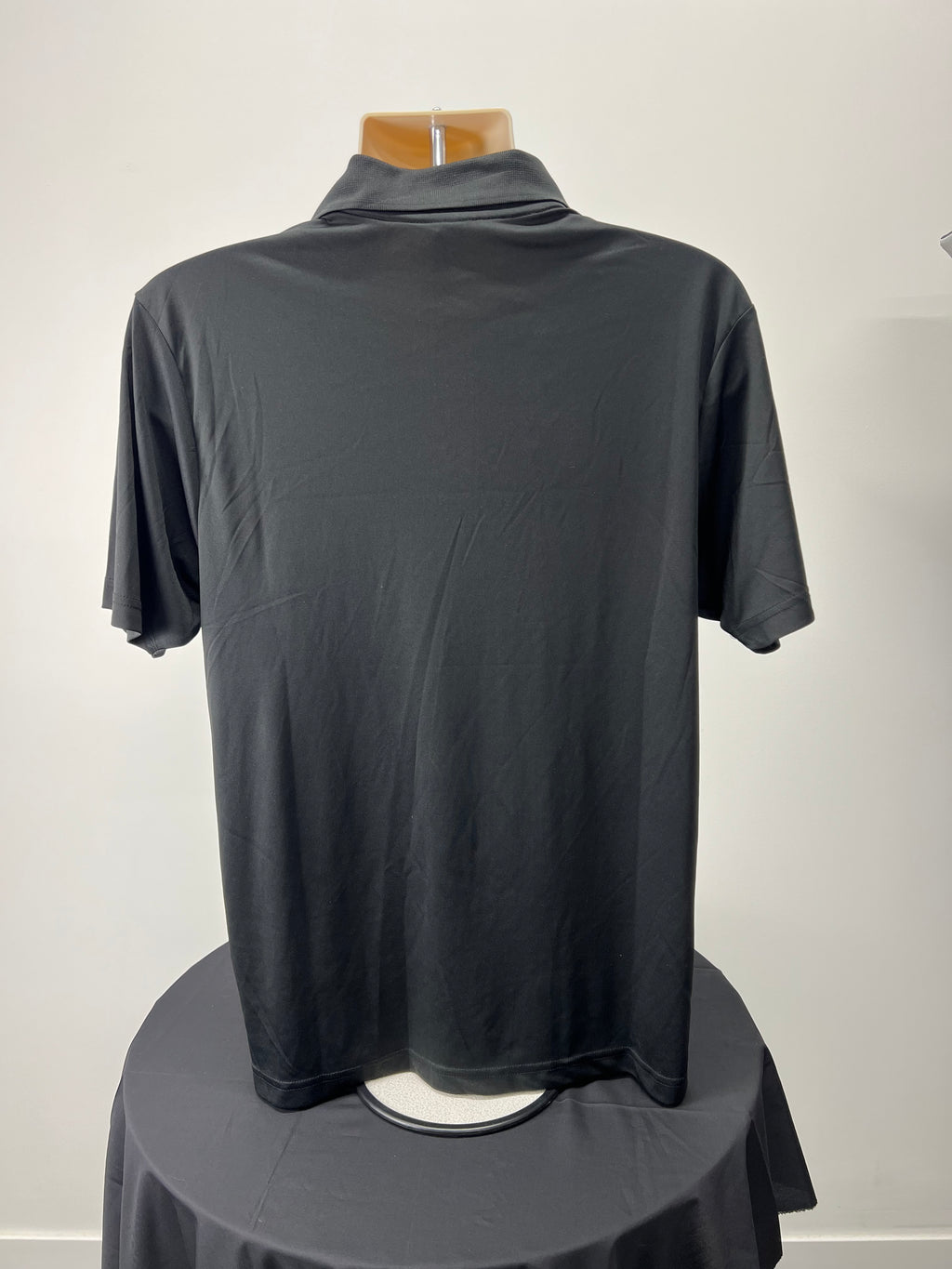 Back view of plain black Jamaica rugby polo shirt medium size
