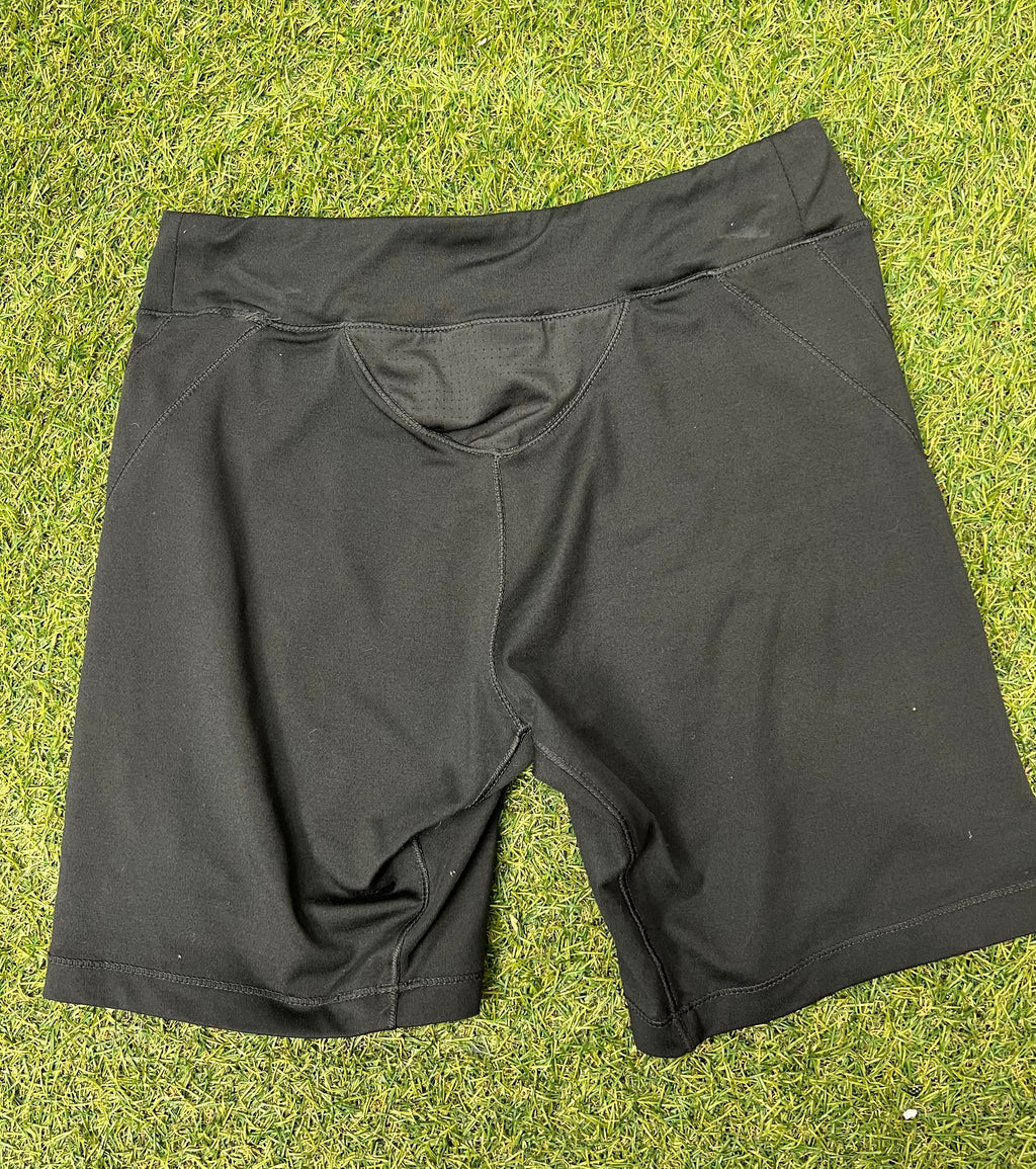 Back view of black women’s LA Gear cycling shorts showing padded insert detail