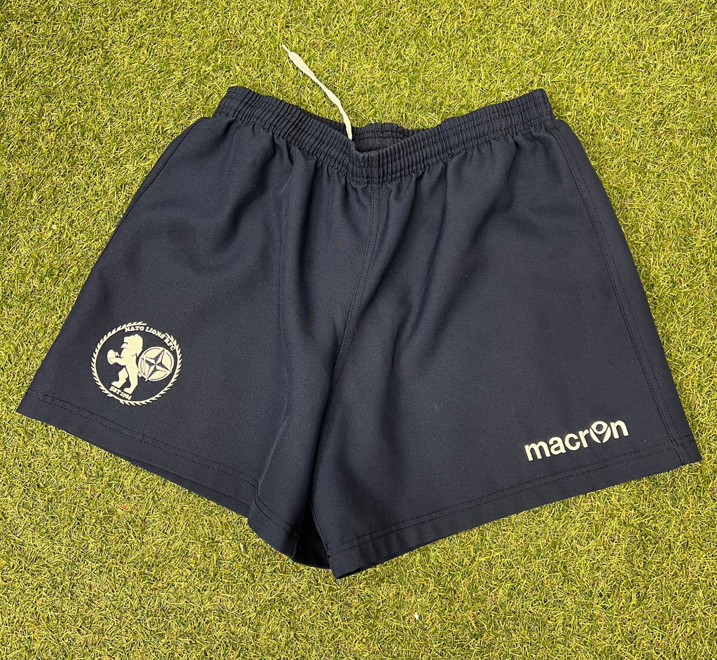 Front view of navy men’s NATO Lions RFC shorts laid flat showing logo and Macron brand