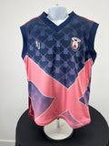 Front view of Kids Wimbledon Cricket Club sleeveless pullover in navy and coral pink with club crest