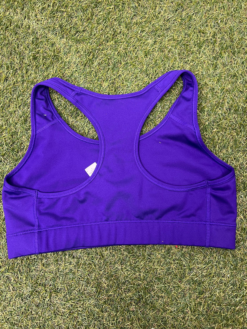 Back view of Nike Pro Dri-FIT purple sports bra showing racerback design