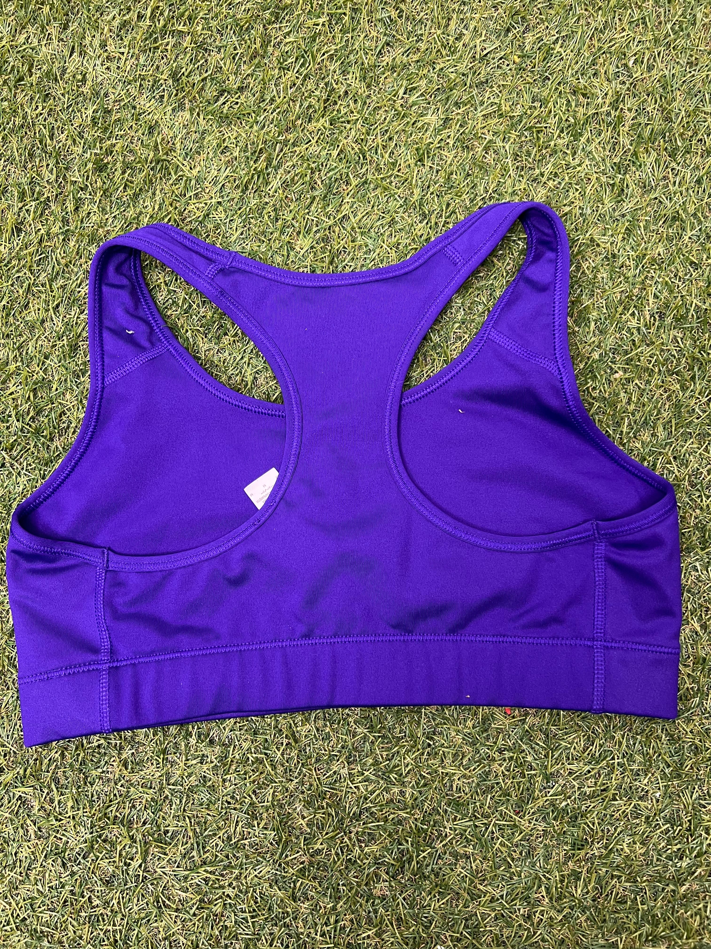 Back view of Nike Pro Dri-FIT purple sports bra showing racerback design